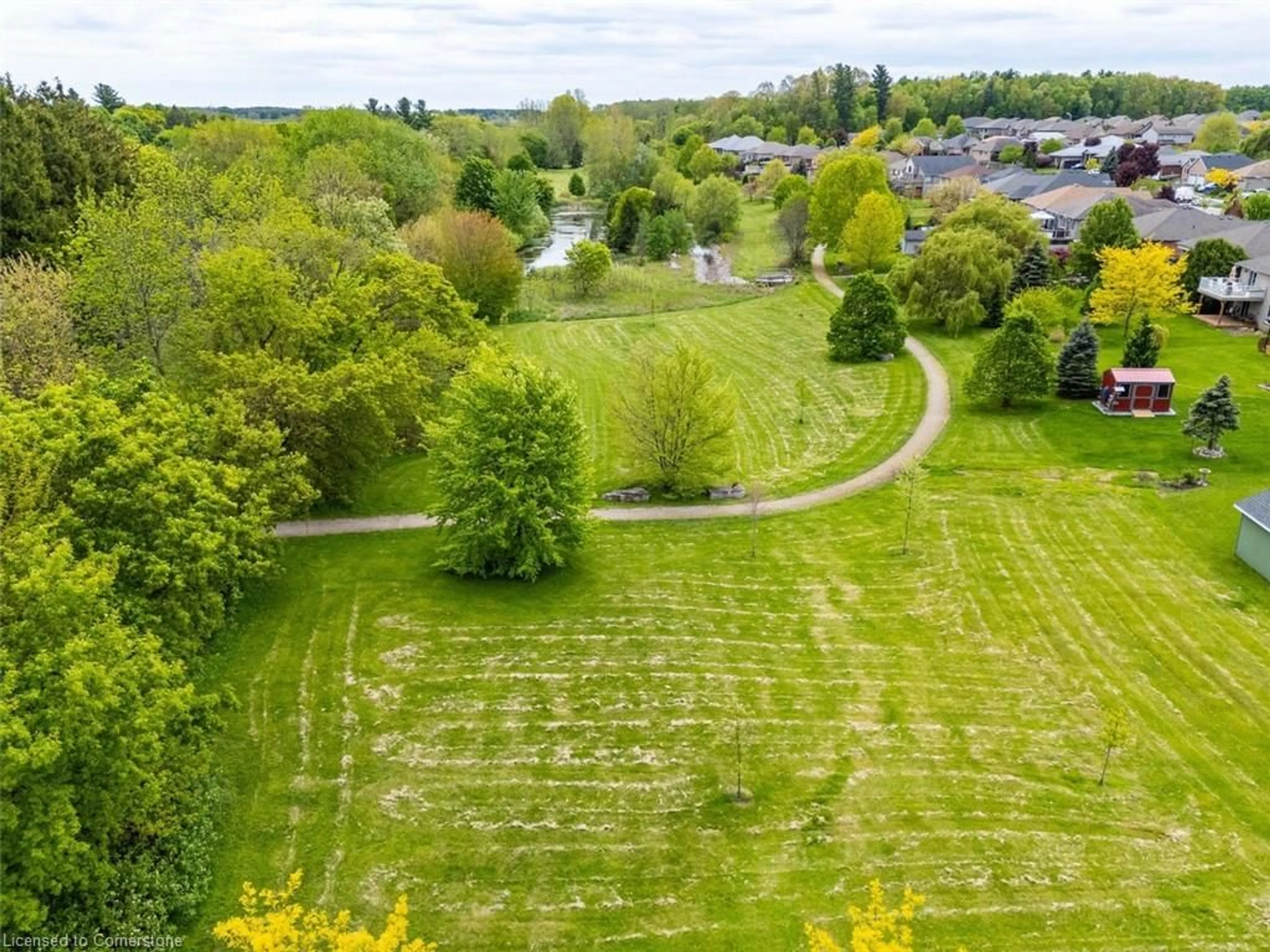 A pic from outside/outdoor area/front of a property/back of a property/a pic from drone, forest/trees view for 409 Queen St #8, Simcoe Ontario N3Y 0A1