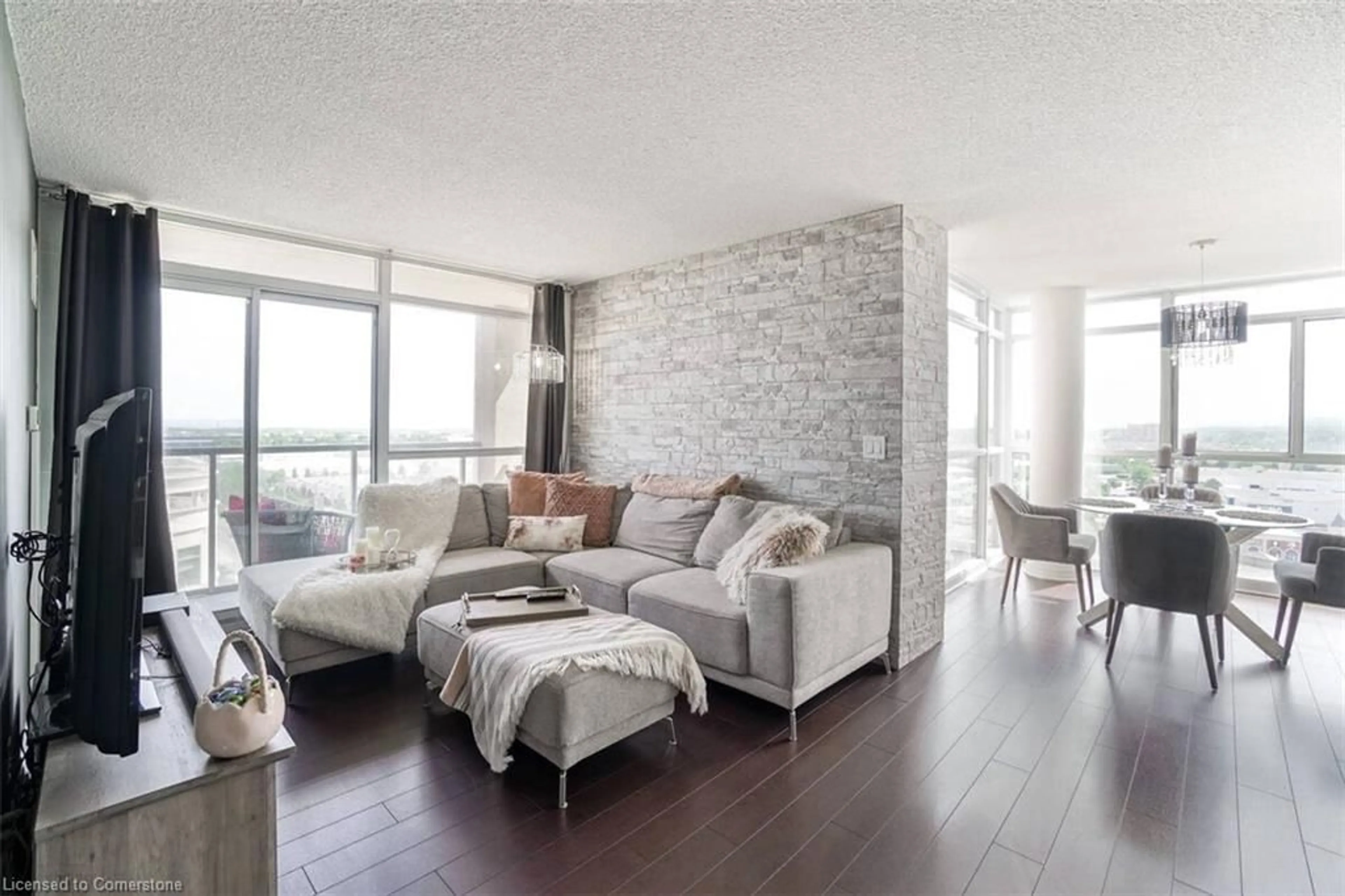 Living room with furniture, wood/laminate floor for 1940 Ironstone Dr #1104, Burlington Ontario L7L 0E4