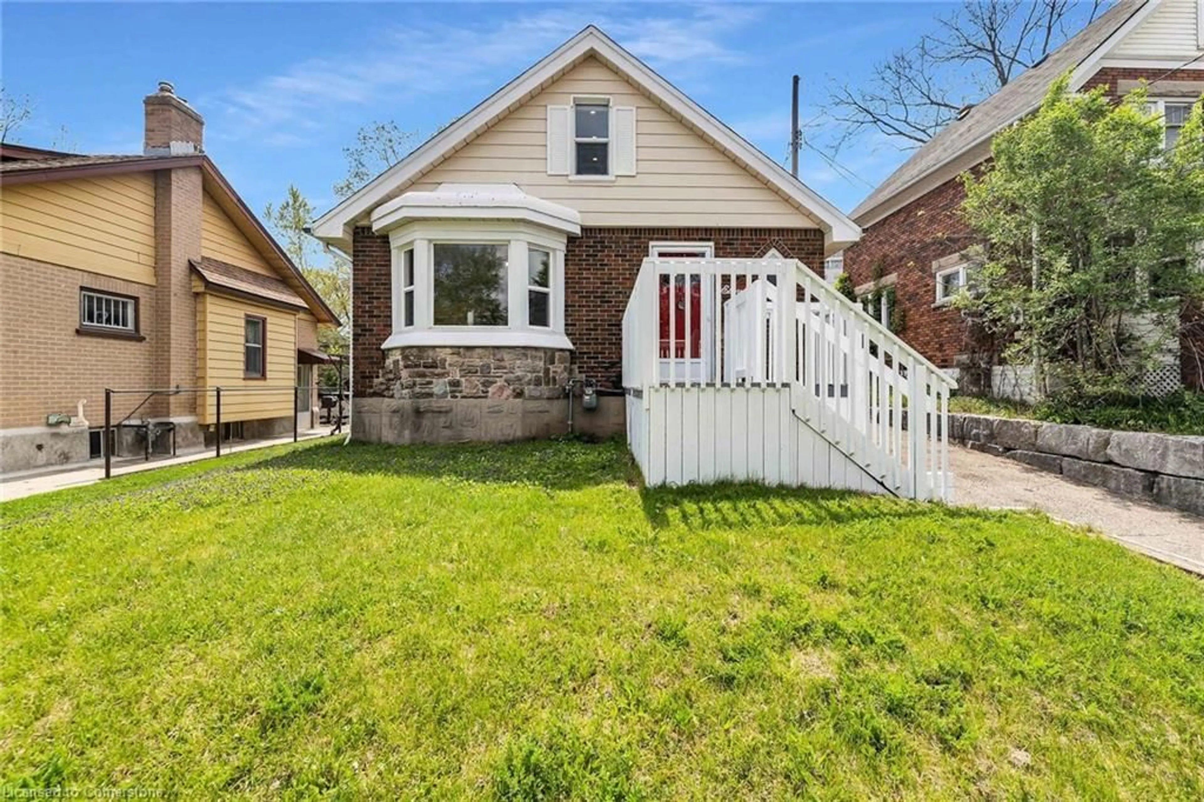 Home with brick exterior material, street for 11 Spadina Rd, Kitchener Ontario N2M 3X2