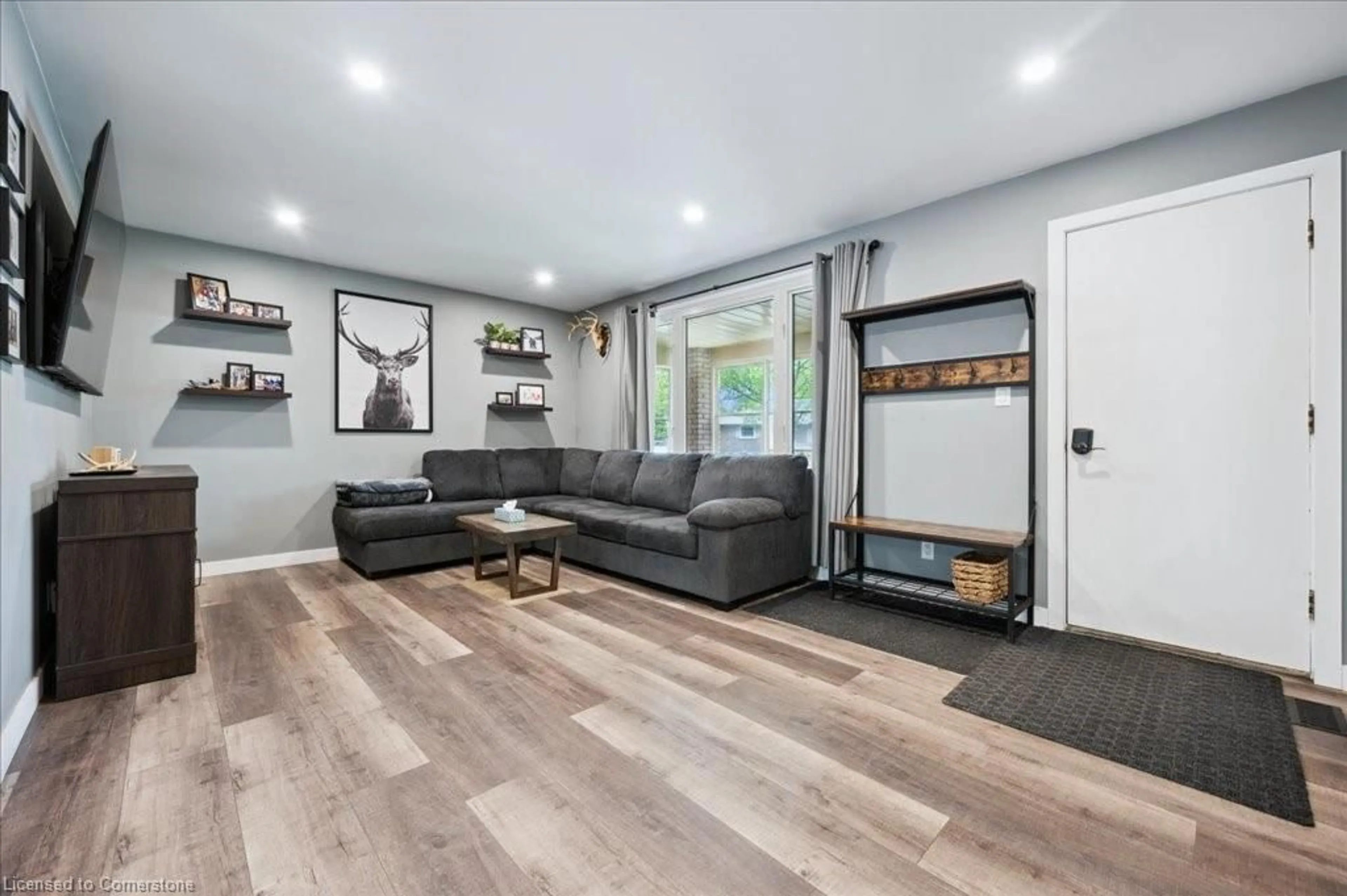 Living room with furniture, wood/laminate floor for 67 Hillmount St, Kitchener Ontario N2C 2C5