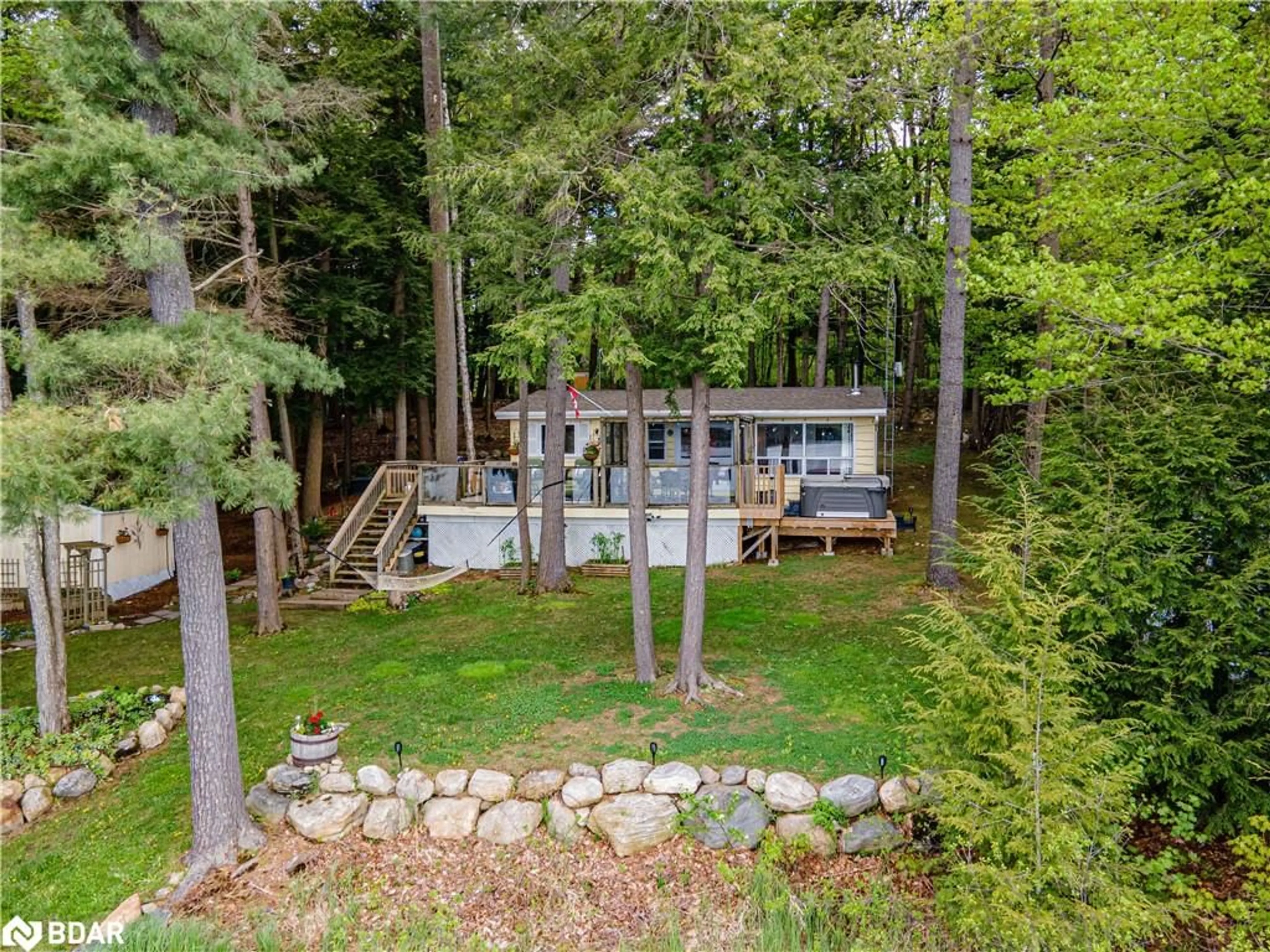 A pic from outside/outdoor area/front of a property/back of a property/a pic from drone, forest/trees view for 1019 Carls Rd Rd, Port Carling Ontario P0B 1J0