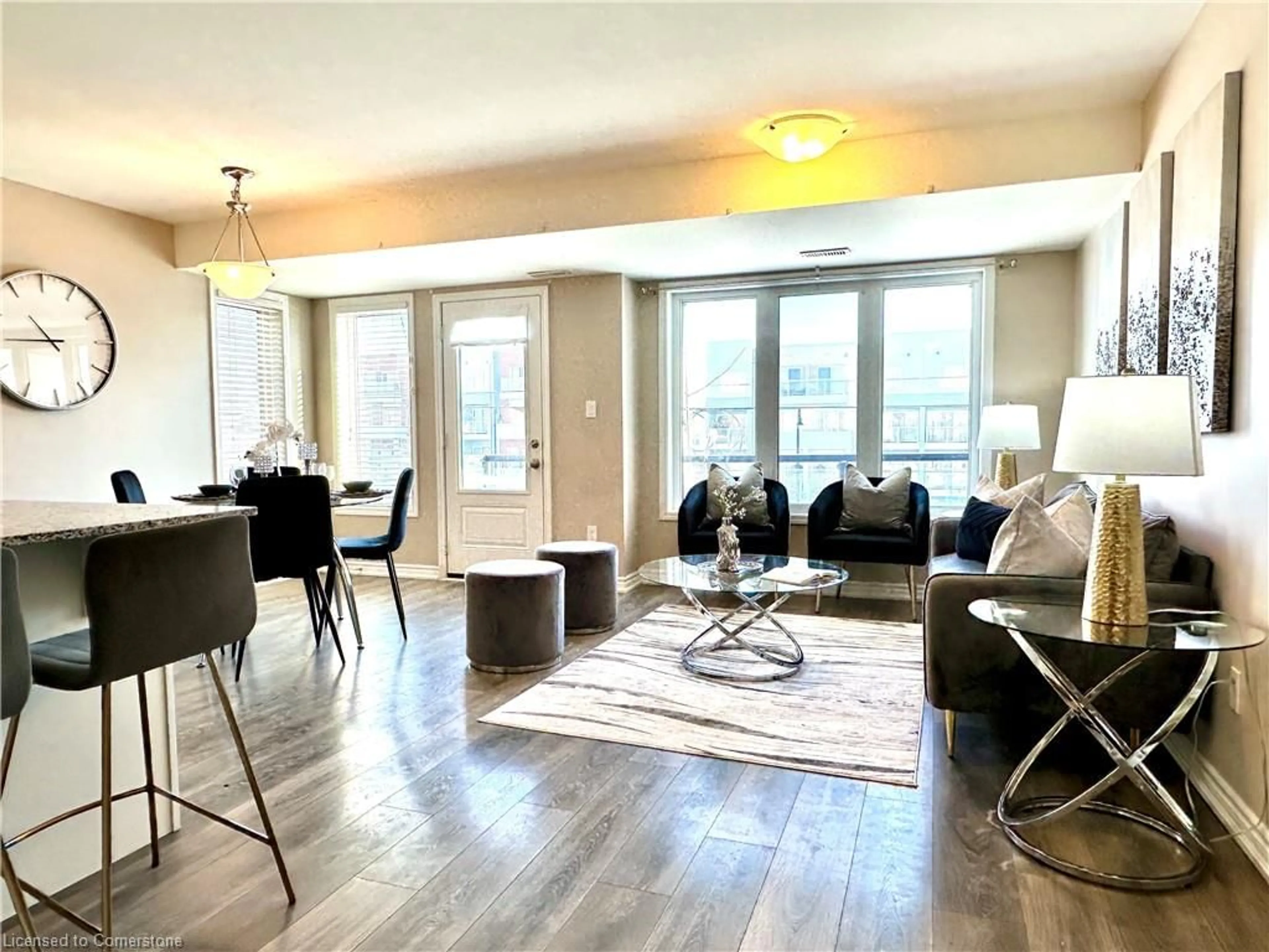 Living room with furniture, wood/laminate floor for 138 Daylily Lane, Kitchener Ontario N2R 0L7