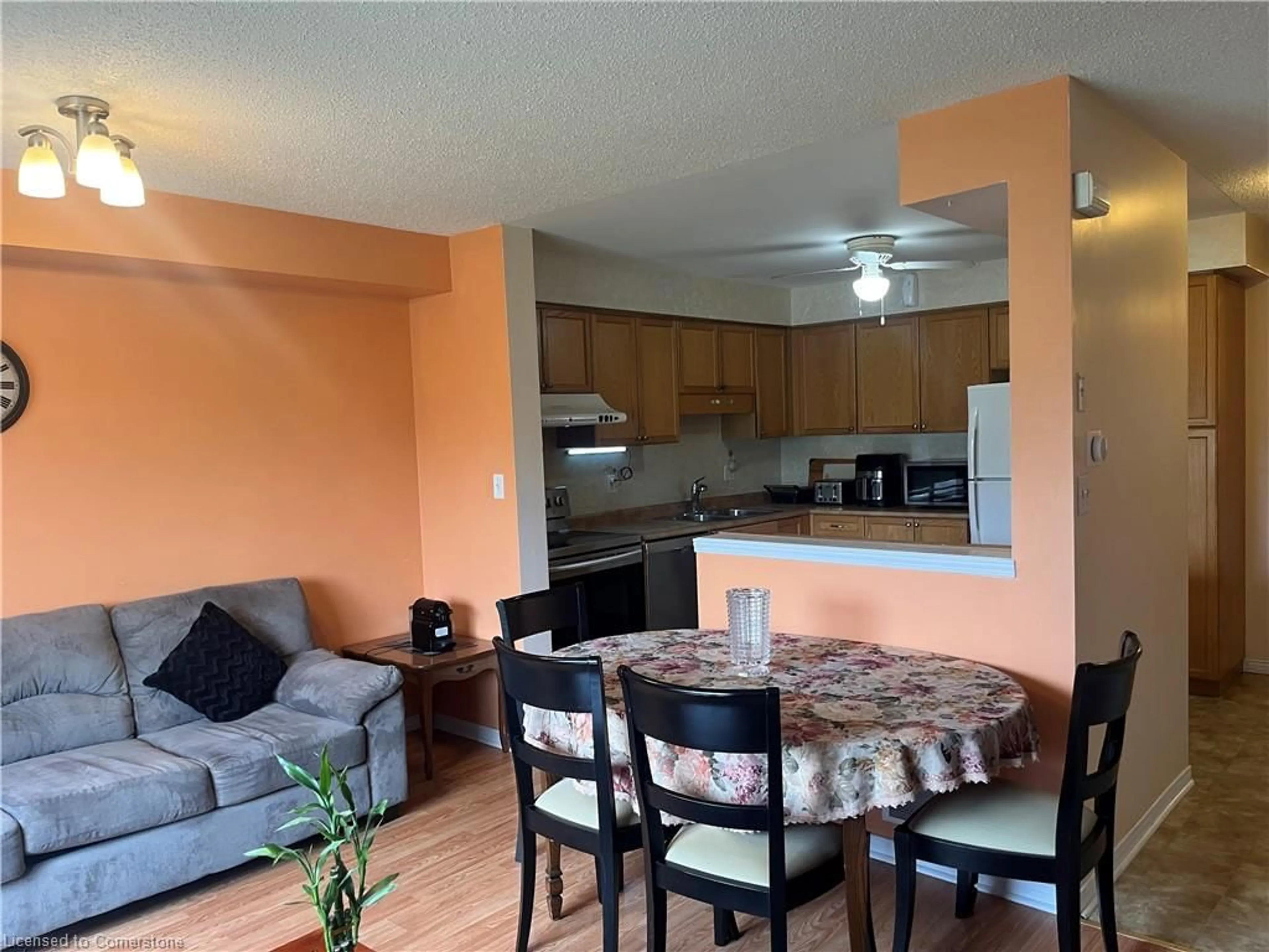 Living room with furniture, wood/laminate floor for 30 Imperial Rd S Rd #11, Guelph Ontario N1K 1Y2