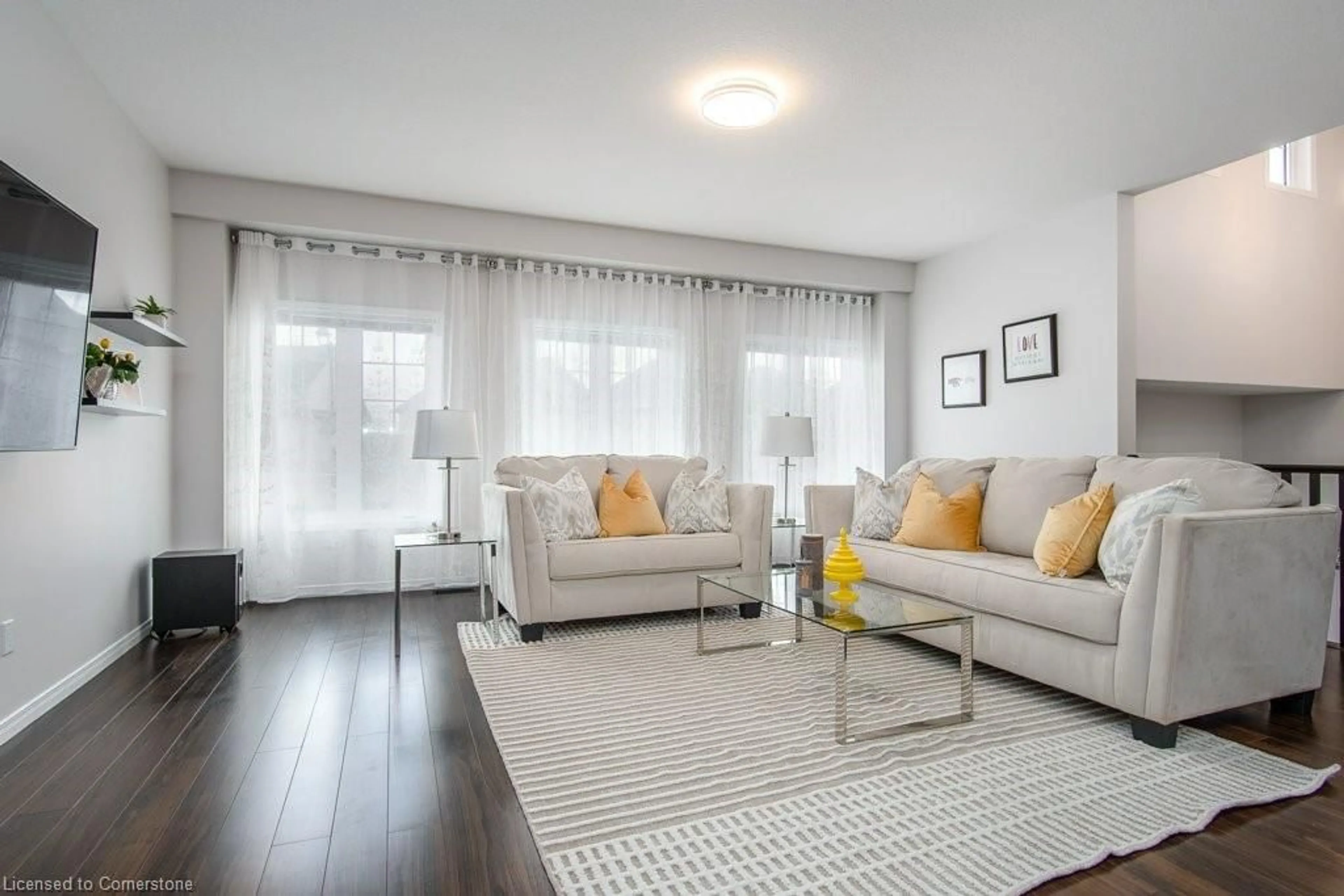 Living room with furniture, wood/laminate floor for 573 Sundew Dr, Waterloo Ontario N2V 0B9