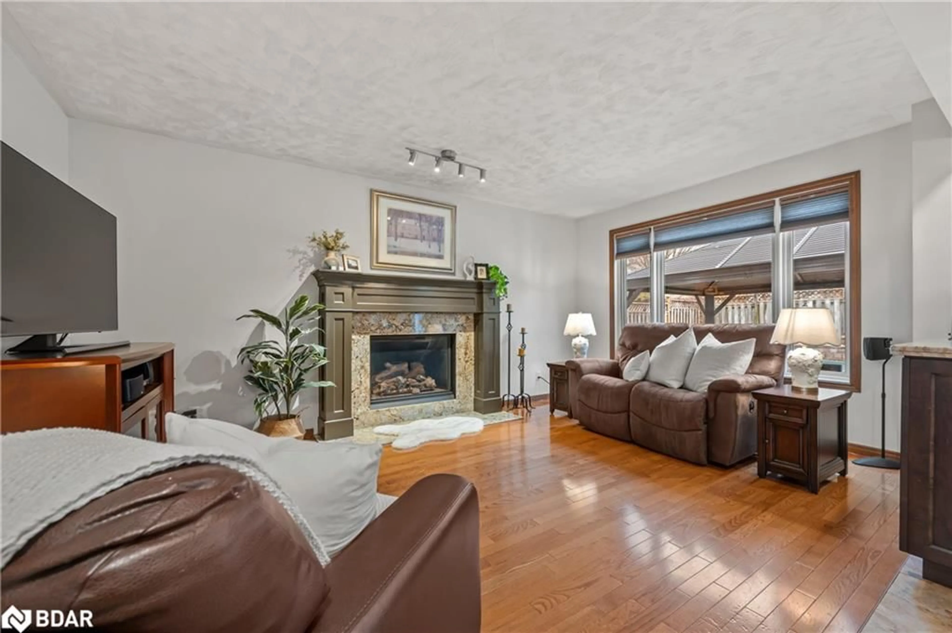 Living room with furniture, wood/laminate floor for 39 Celia Cres Cres, Guelph Ontario N1G 4R4