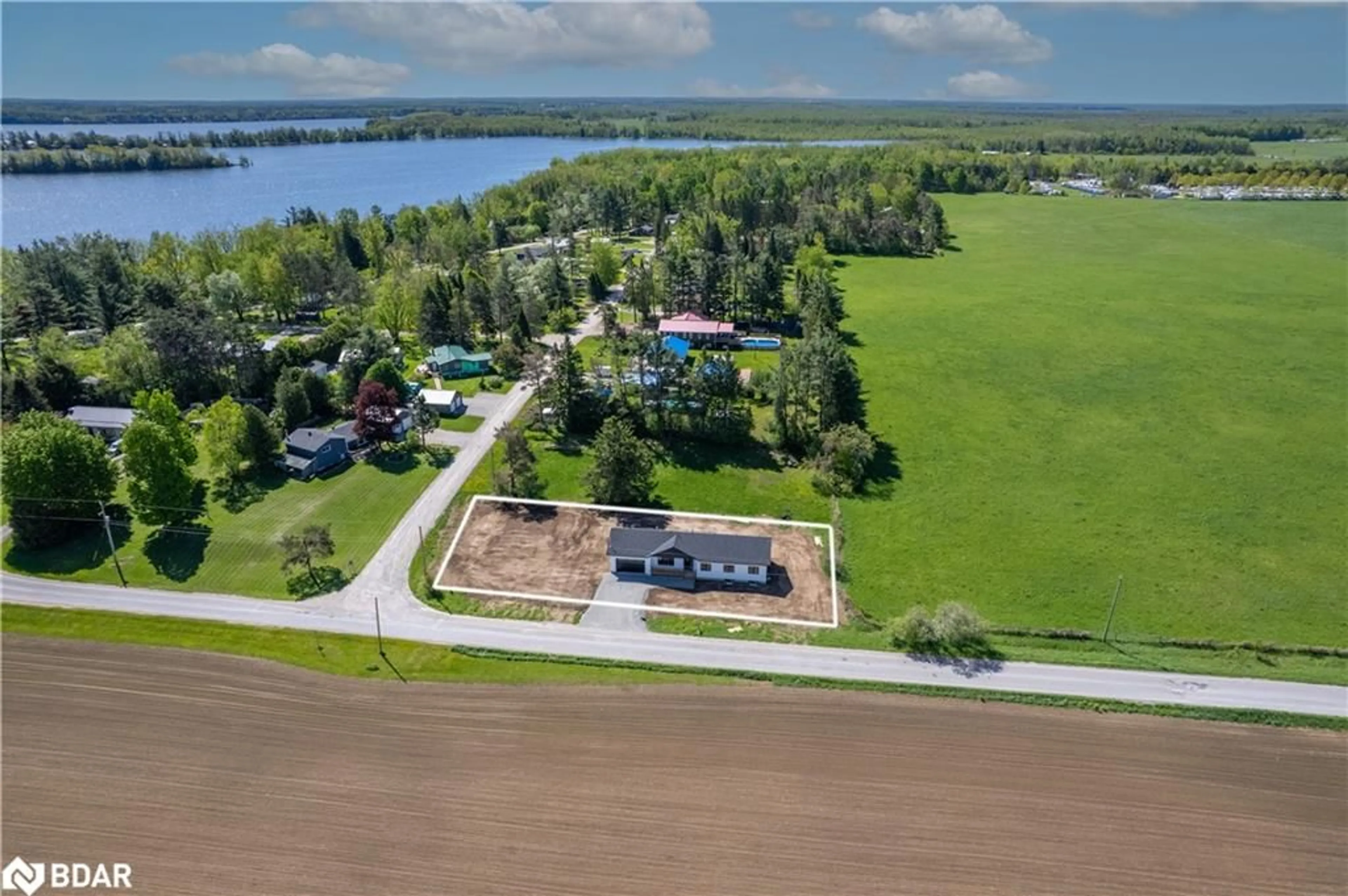 A pic from outside/outdoor area/front of a property/back of a property/a pic from drone, water/lake/river/ocean view for 0 Fulsom Cres, Sebright Ontario L3V 6H5