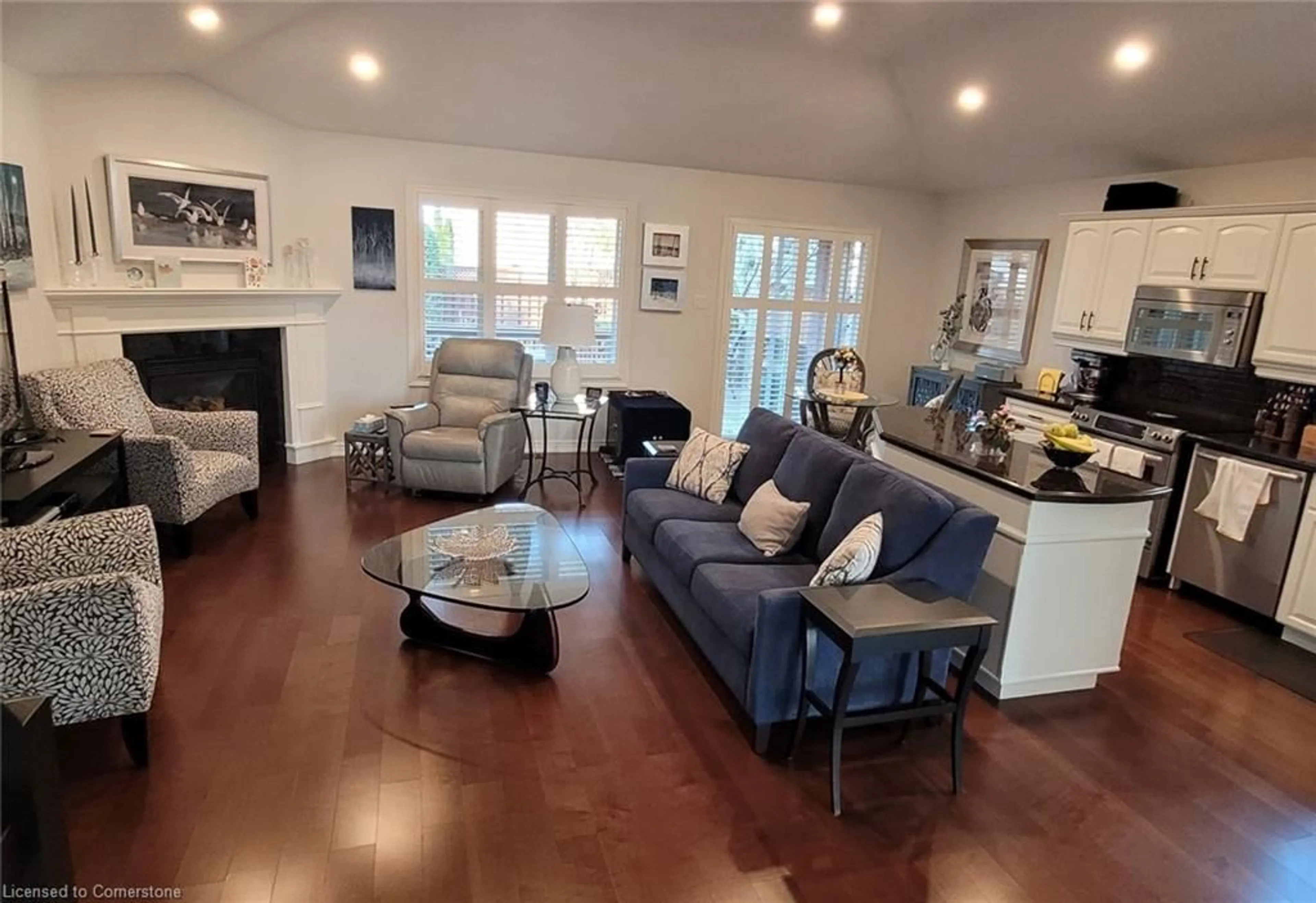 Living room with furniture, wood/laminate floor for 39 Emidio Cres, Brantford Ontario N3R 7Z1