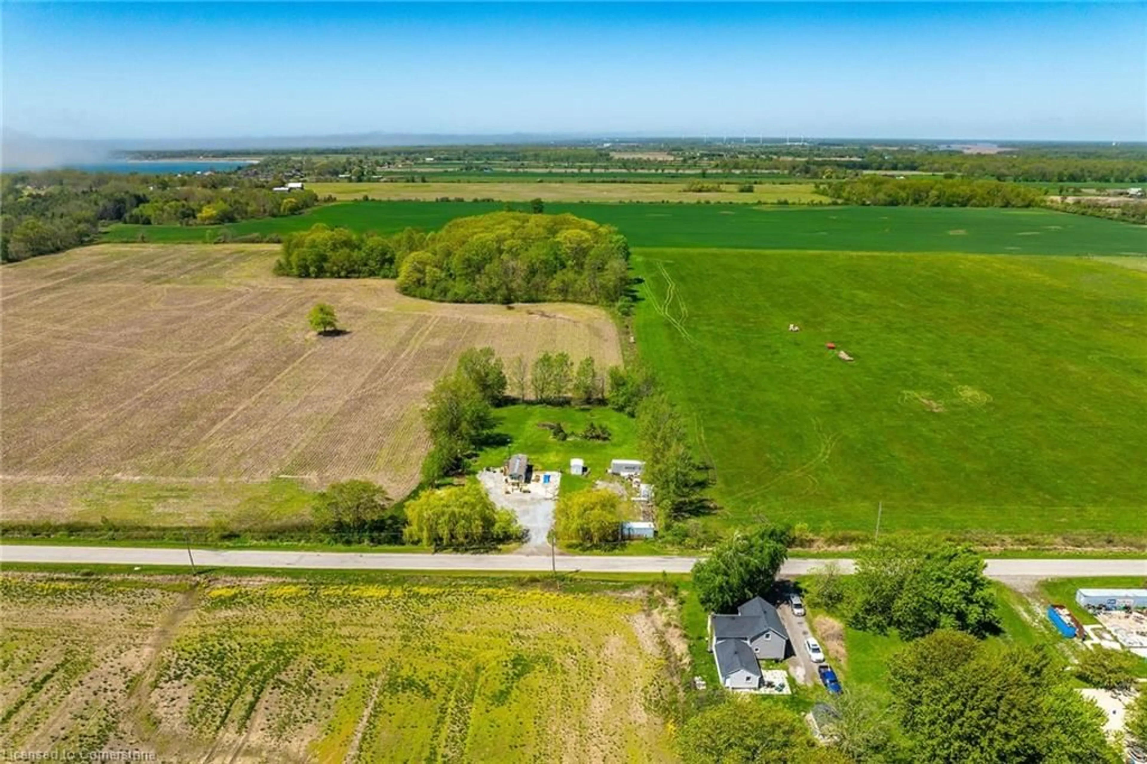 A pic from outside/outdoor area/front of a property/back of a property/a pic from drone, water/lake/river/ocean view for 199 Dickhout Rd, Lowbanks Ontario N0A 1K0