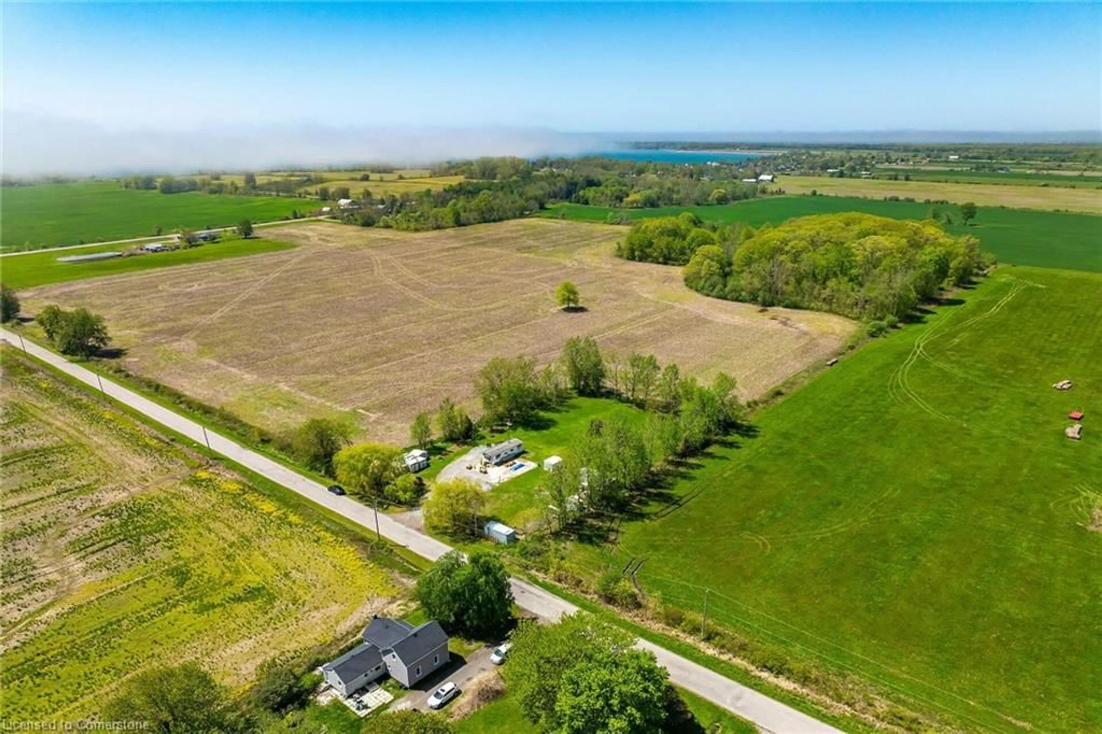 A pic from outside/outdoor area/front of a property/back of a property/a pic from drone, water/lake/river/ocean view for 199 Dickhout Rd, Lowbanks Ontario N0A 1K0