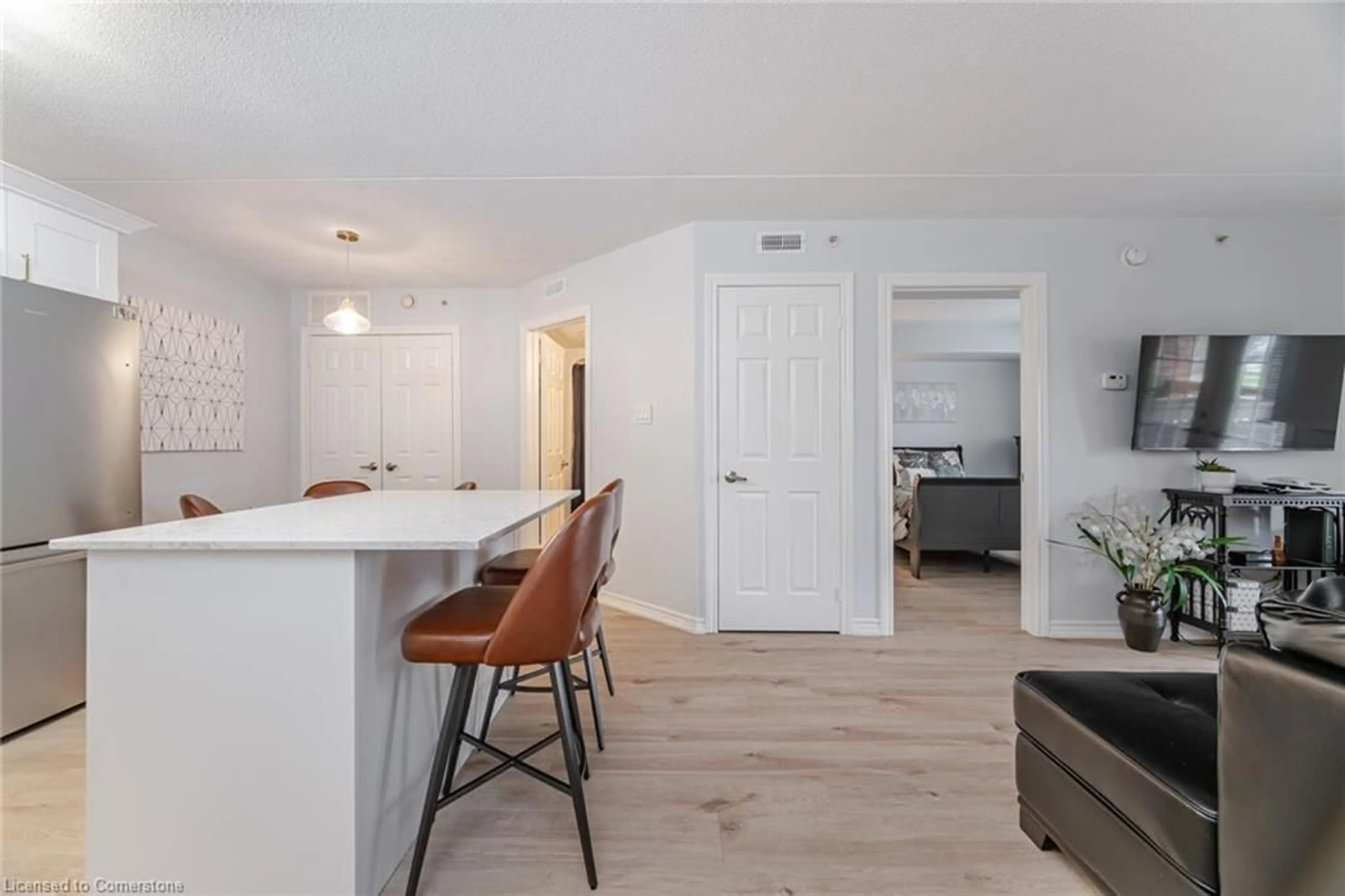 Open concept kitchen, wood/laminate floor for 4005 Kilmer Dr #104, Burlington Ontario L7M 4M2