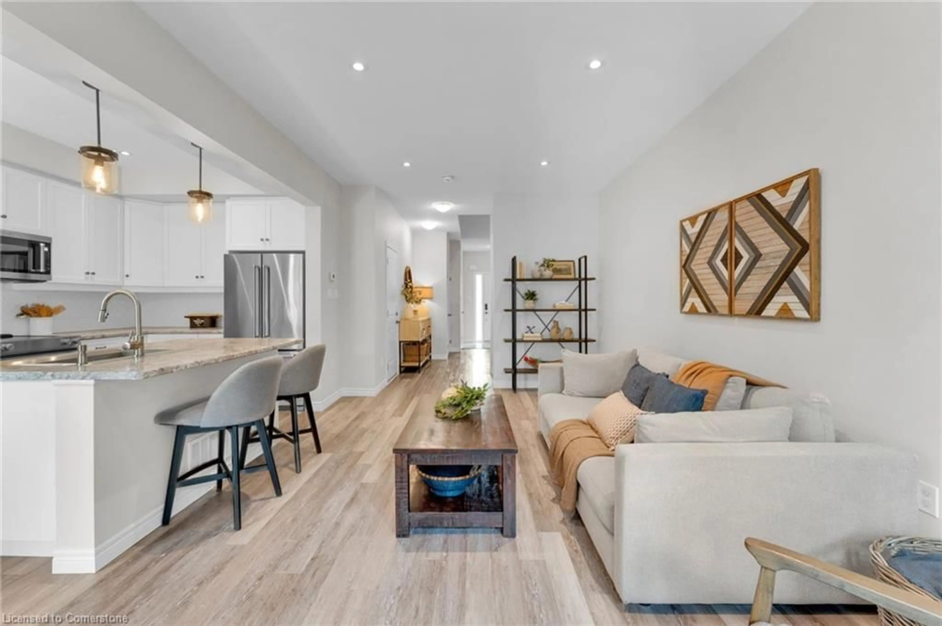 Living room with furniture, wood/laminate floor for 15 Dennis Dr, Smithville Ontario L0R 2A0