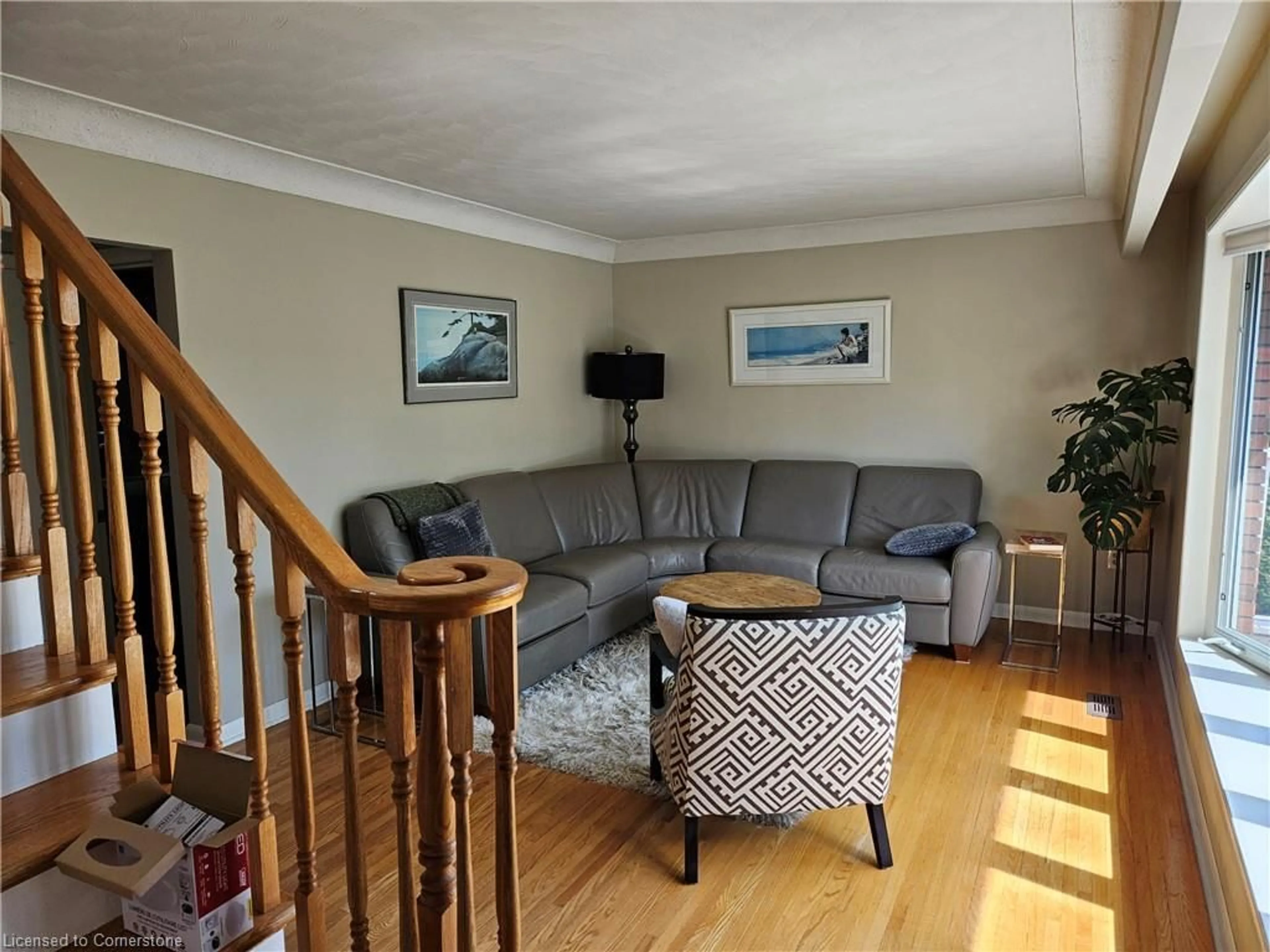 Living room with furniture, wood/laminate floor for 130 West 26th St, Hamilton Ontario L9C 4Z4