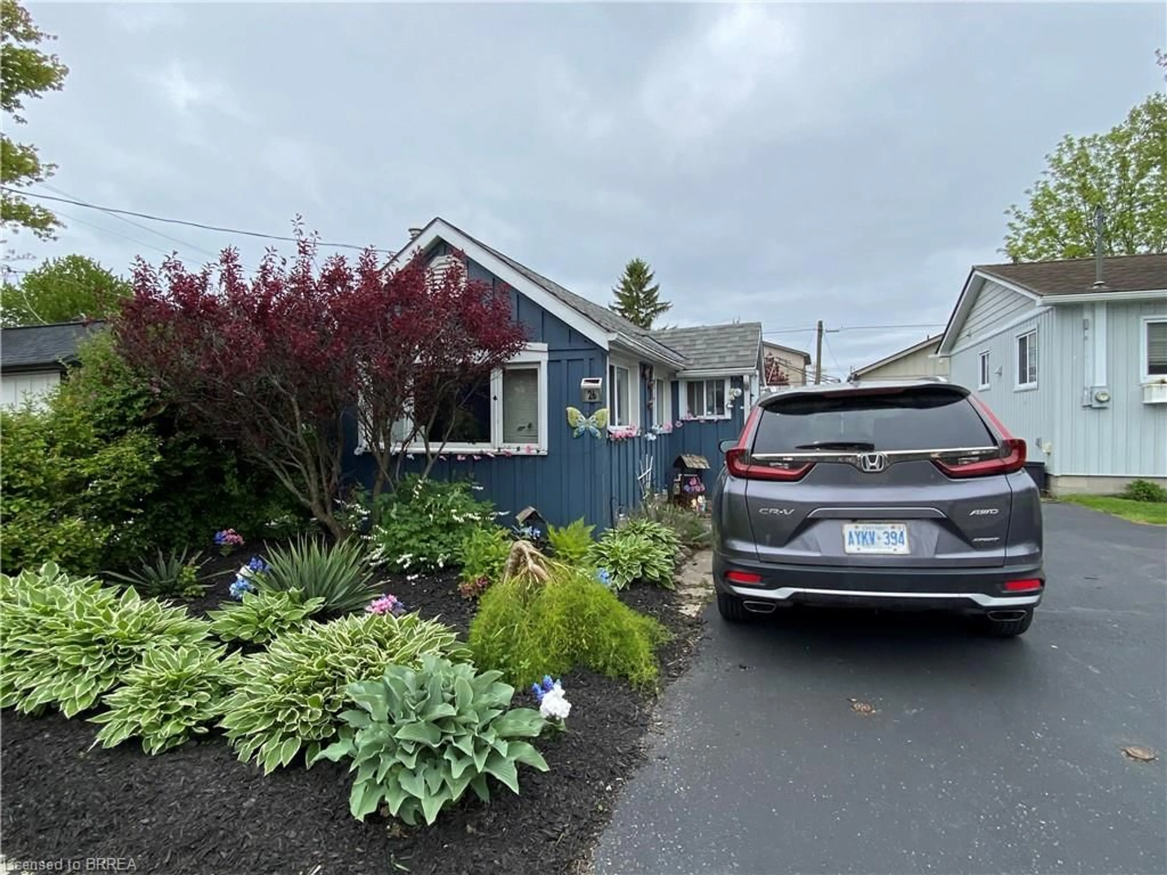 Home with vinyl exterior material, street for 26 Pansy Ave, Port Dover Ontario N0A 1N7