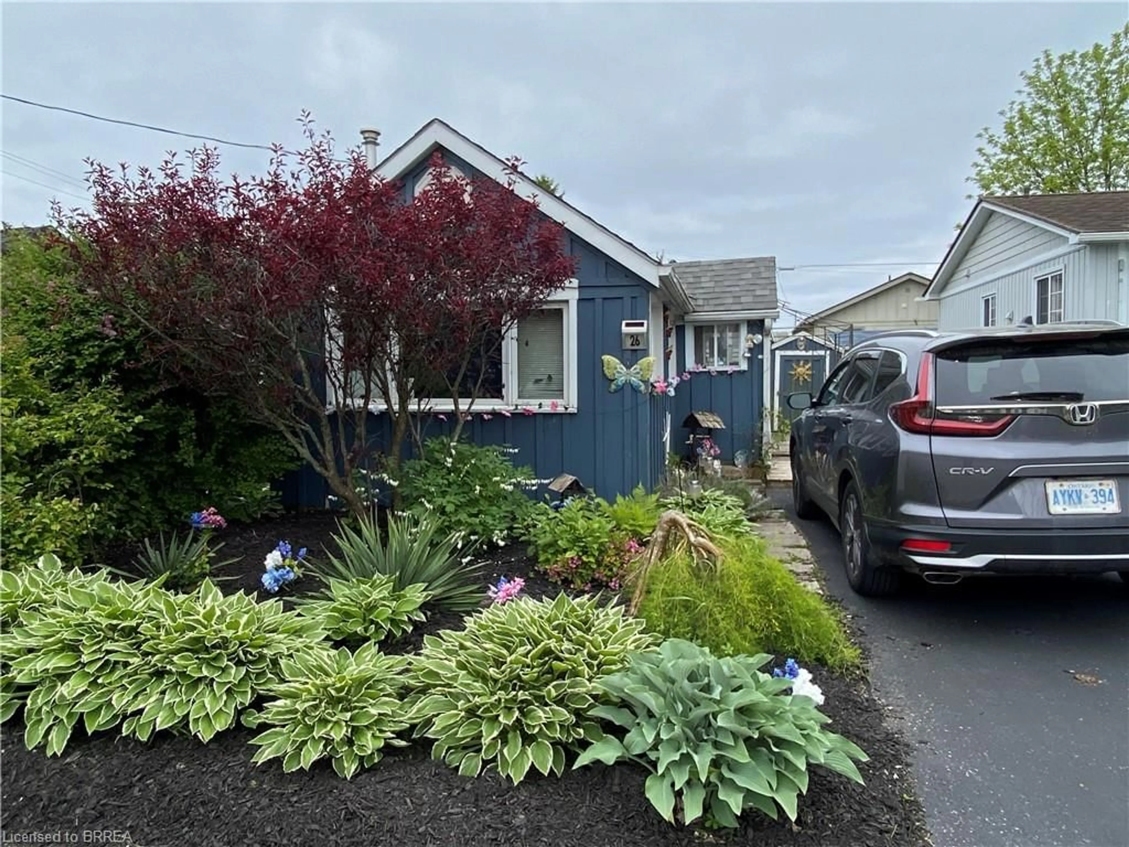 Home with vinyl exterior material, street for 26 Pansy Ave, Port Dover Ontario N0A 1N7