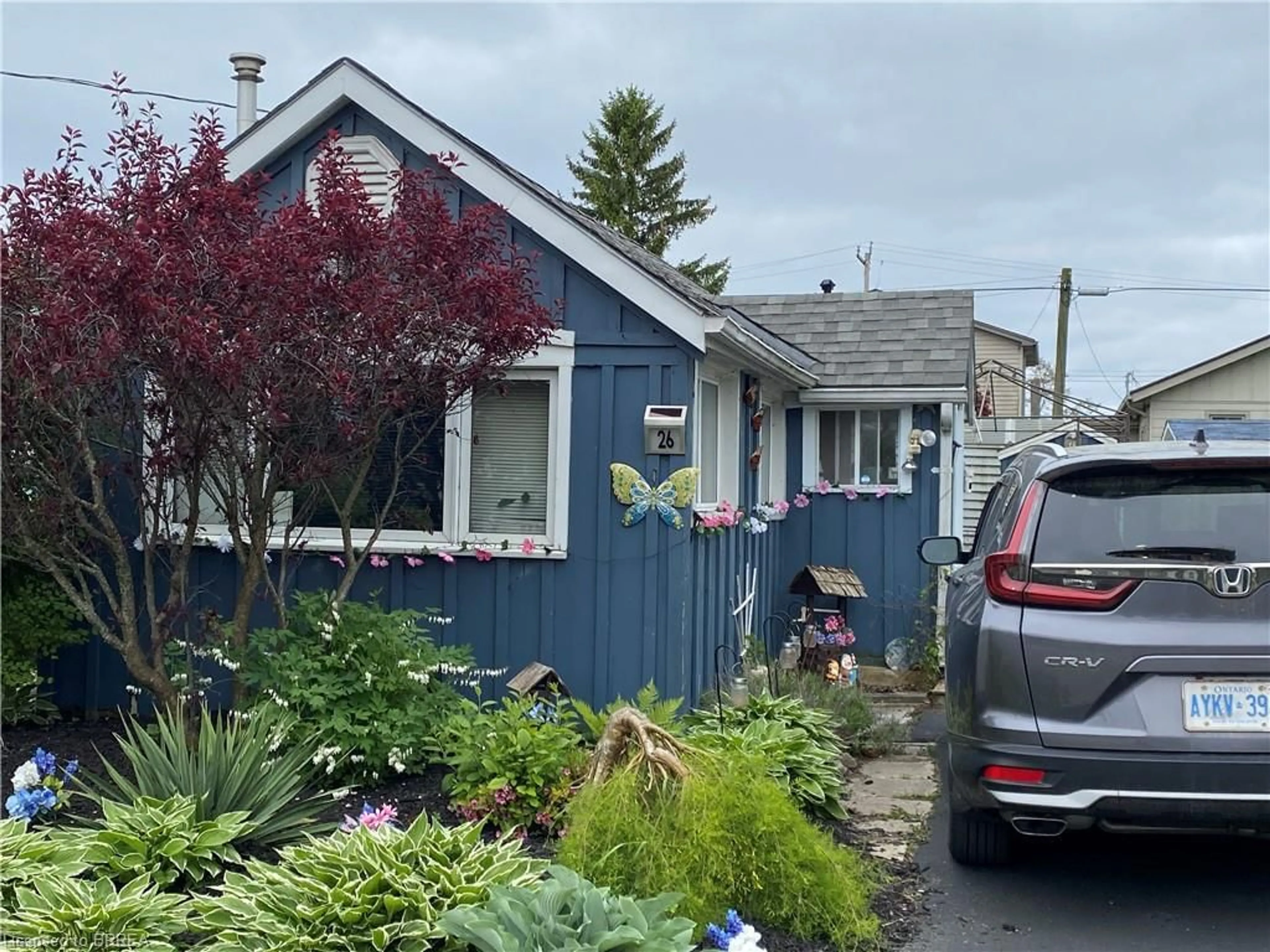 Home with vinyl exterior material, street for 26 Pansy Ave, Port Dover Ontario N0A 1N7