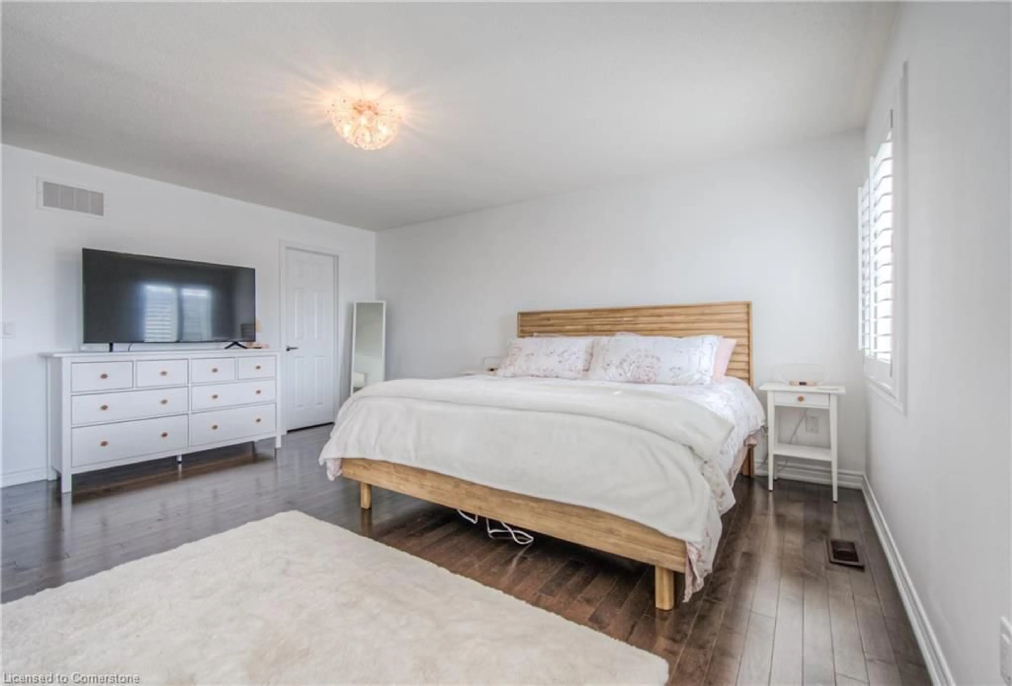 Bedroom with bed, wood/laminate floor for 174 Etheridge Ave, Milton Ontario L9E 1H1