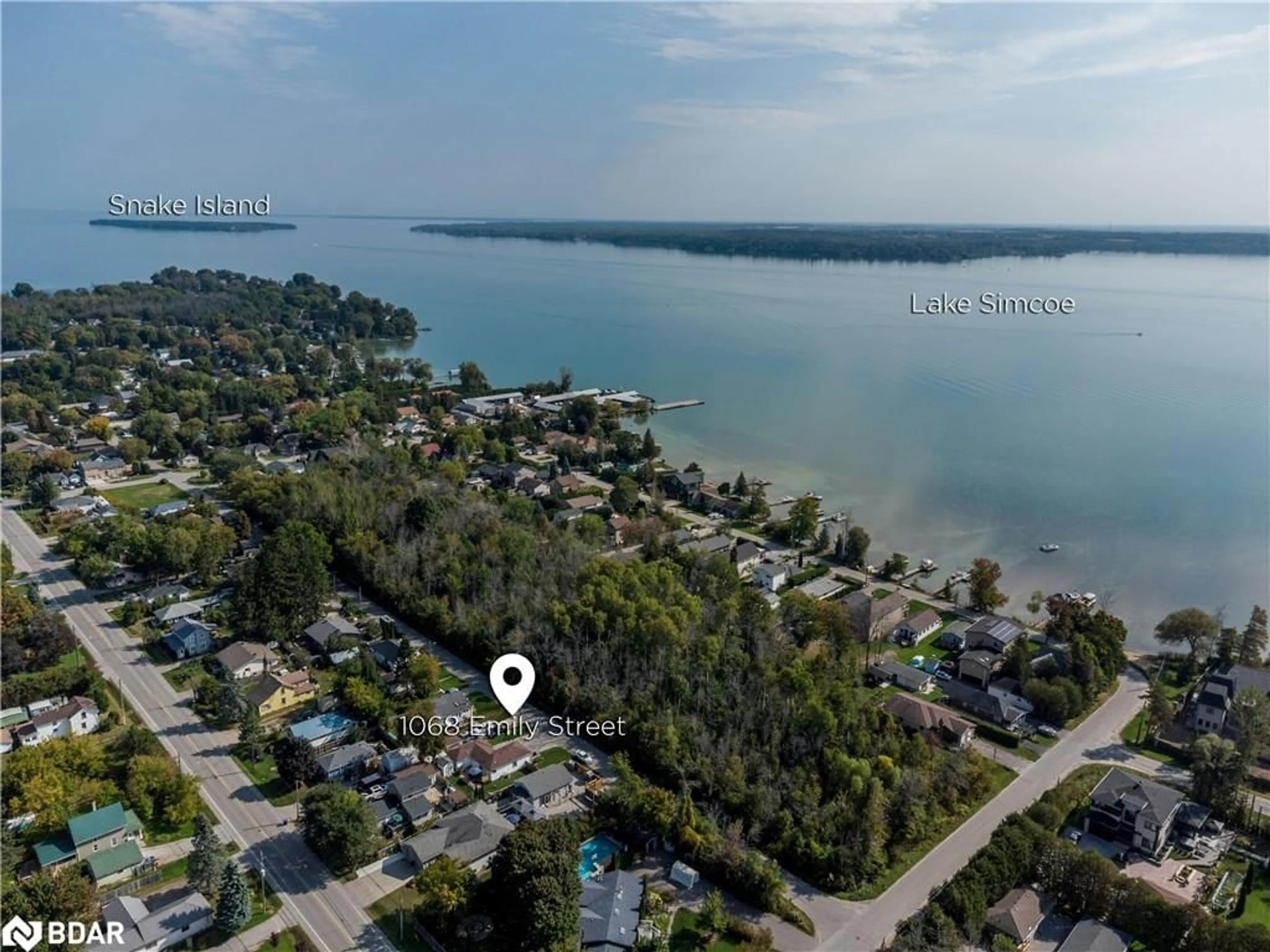 A pic from outside/outdoor area/front of a property/back of a property/a pic from drone, water/lake/river/ocean view for 1068 Emily St, Innisfil Ontario L0L 1C0