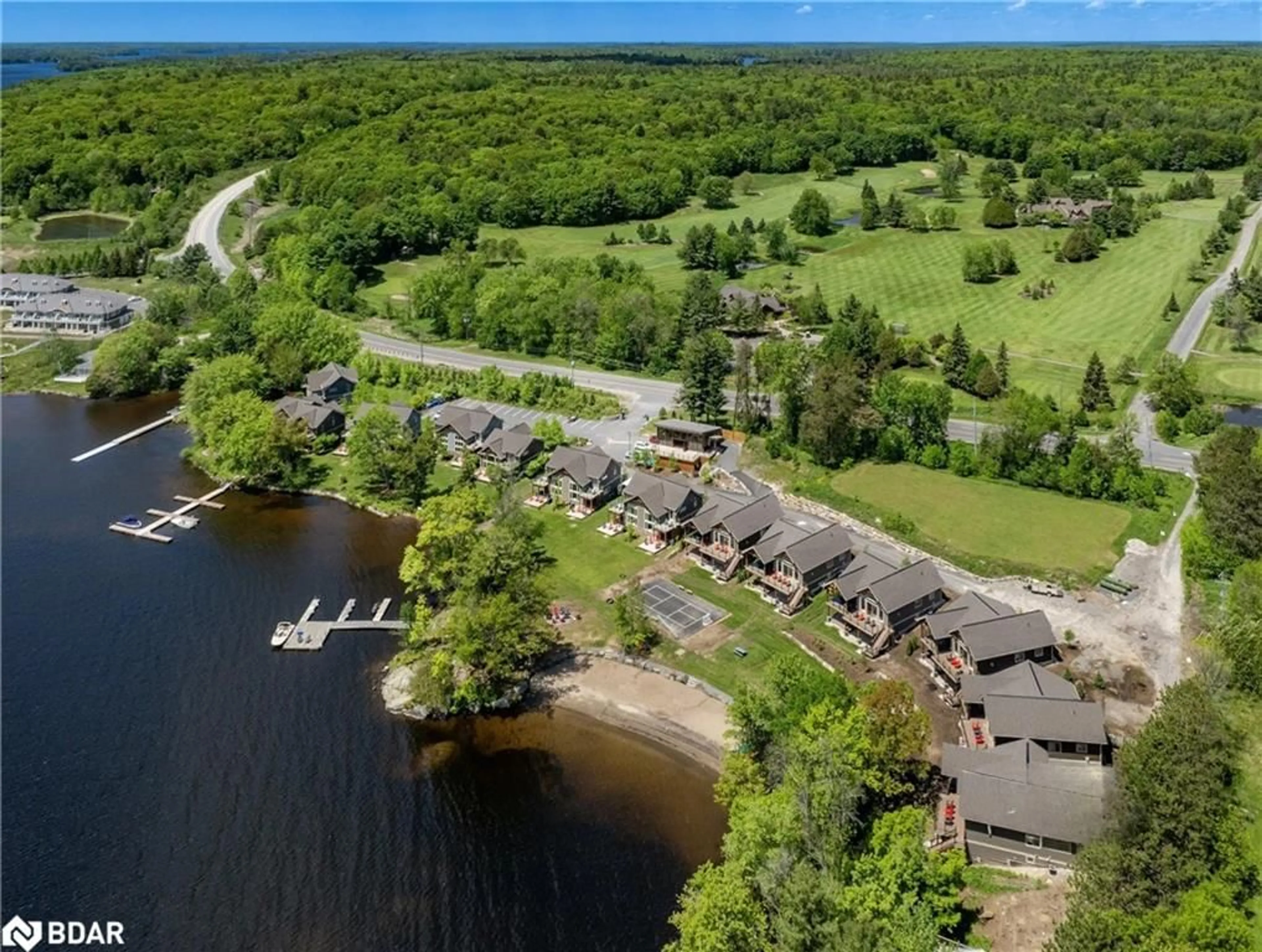 A pic from outside/outdoor area/front of a property/back of a property/a pic from drone, water/lake/river/ocean view for 1841 Muskoka Road 118 Rd #1B, Bracebridge Ontario P1L 1W8