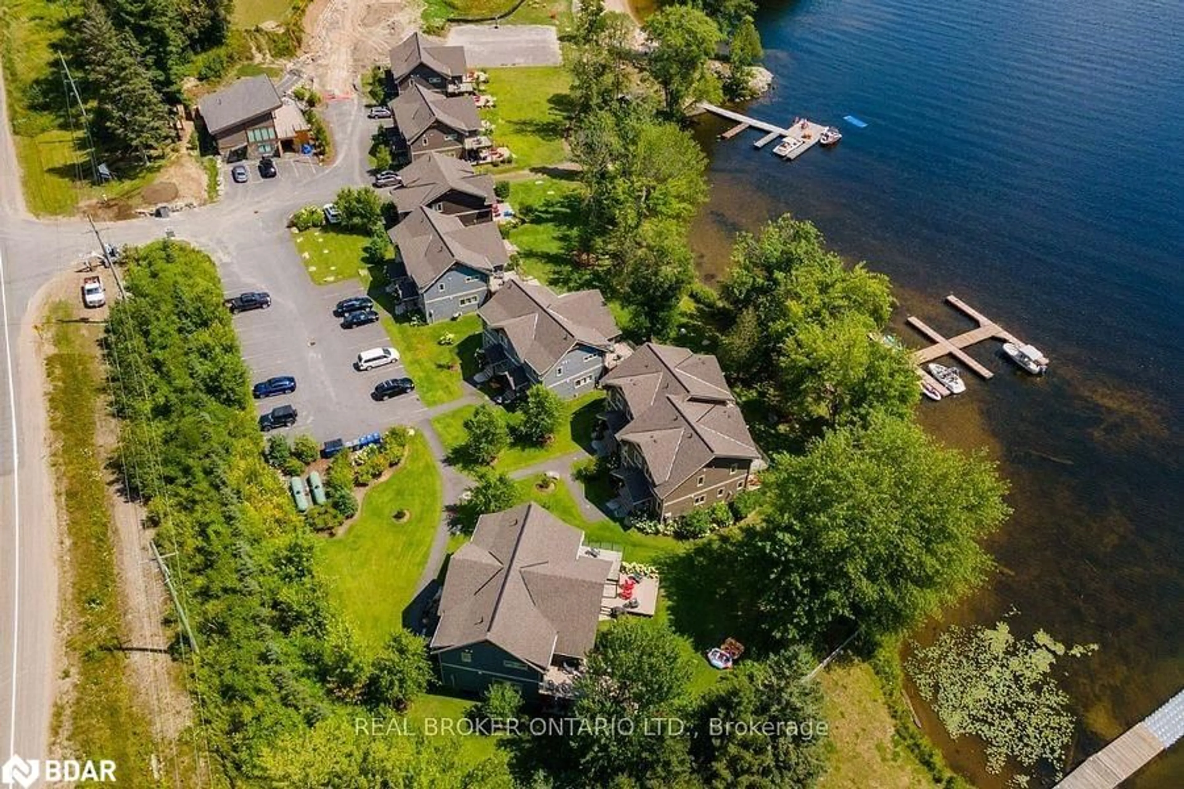 A pic from outside/outdoor area/front of a property/back of a property/a pic from drone, water/lake/river/ocean view for 1841 Muskoka Road 118 Rd #2B, Bracebridge Ontario P1L 1W8