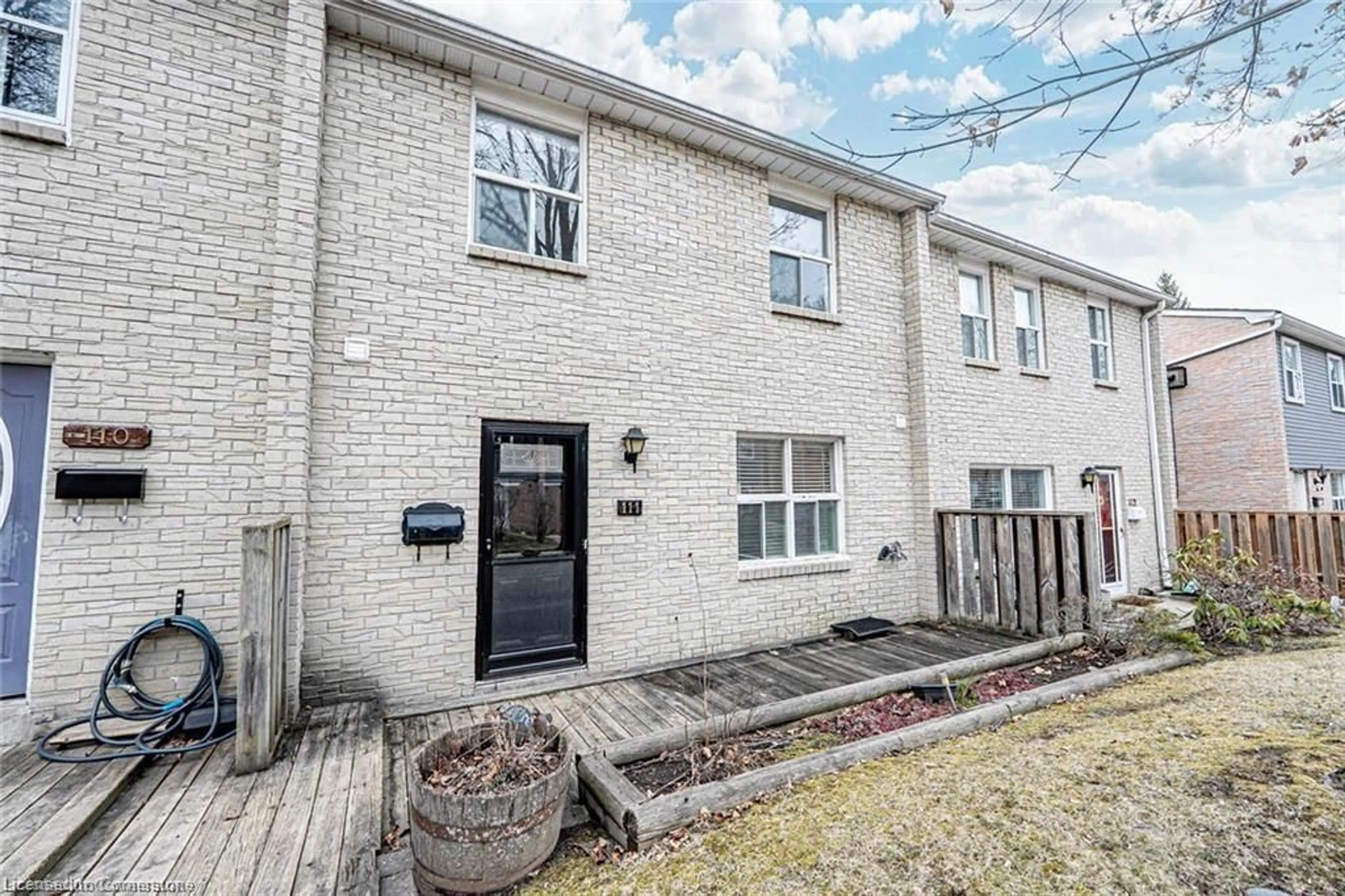 Home with brick exterior material, street for 1050 Shawnmarr Rd #111, Peel Ontario L5H 3V1