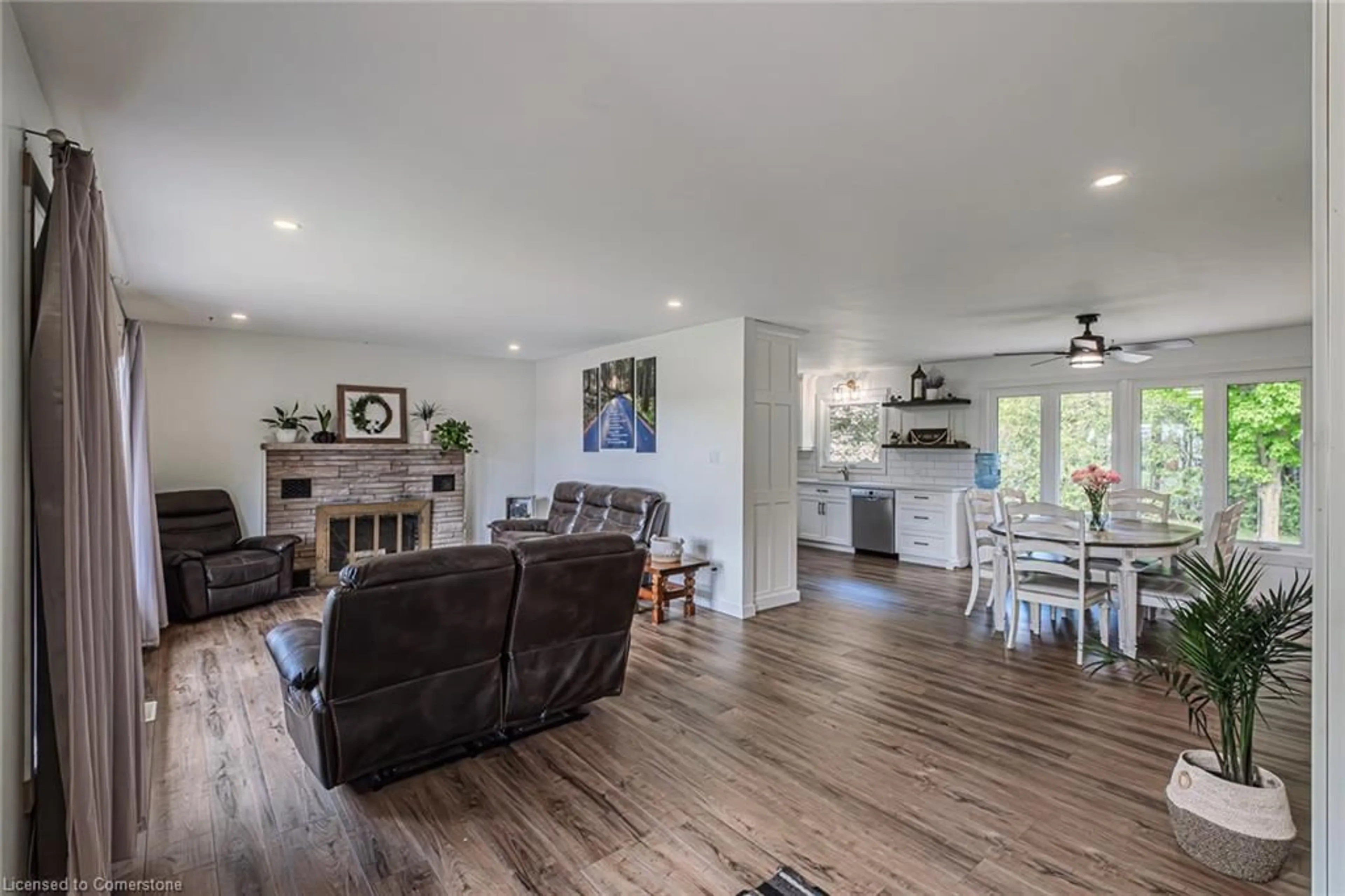 Living room with furniture, wood/laminate floor for 2364 Windham West Quarterline Rd, Simcoe Ontario N3Y 4J9