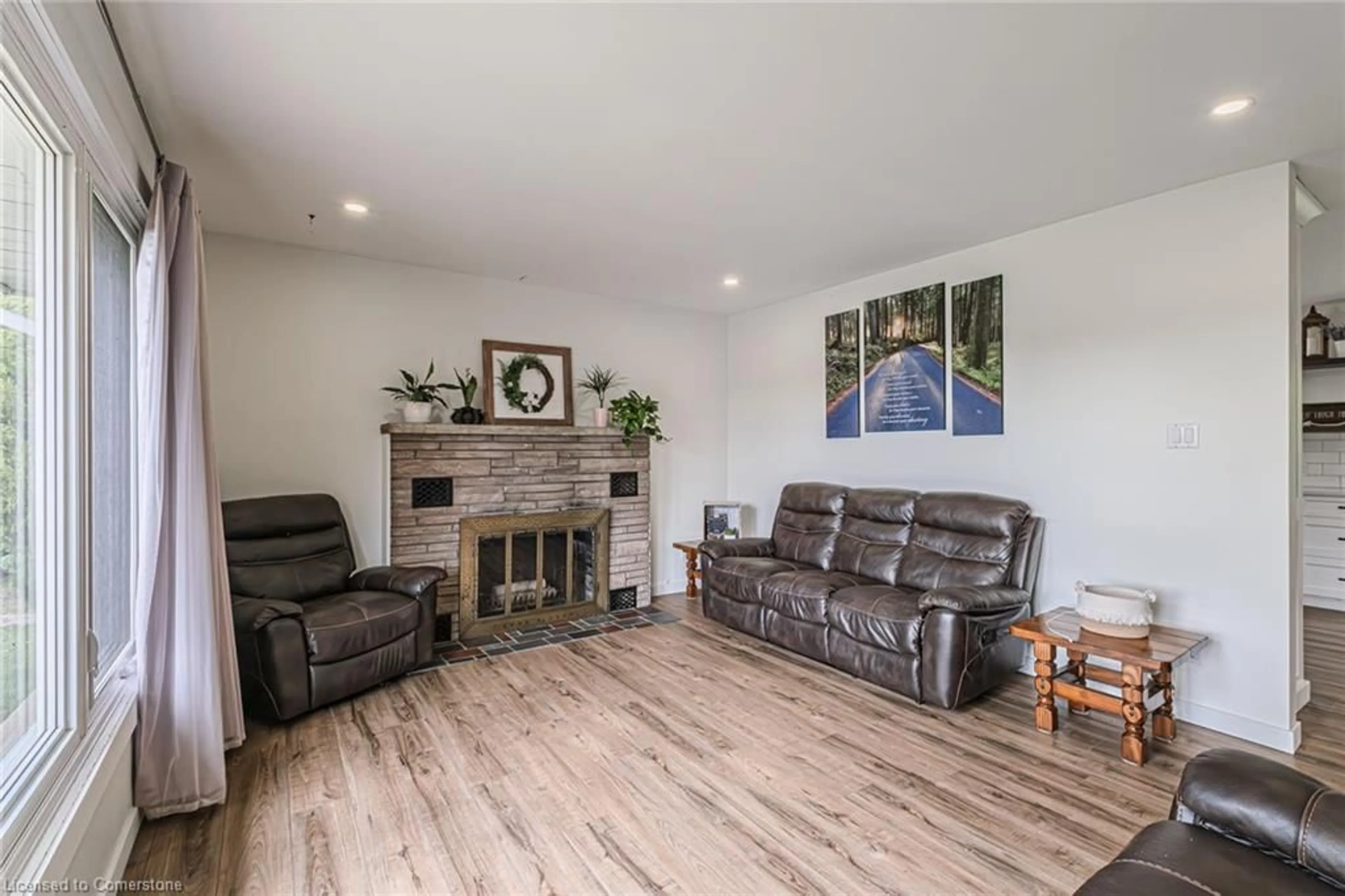 Living room with furniture, wood/laminate floor for 2364 Windham West Quarterline Rd, Simcoe Ontario N3Y 4J9