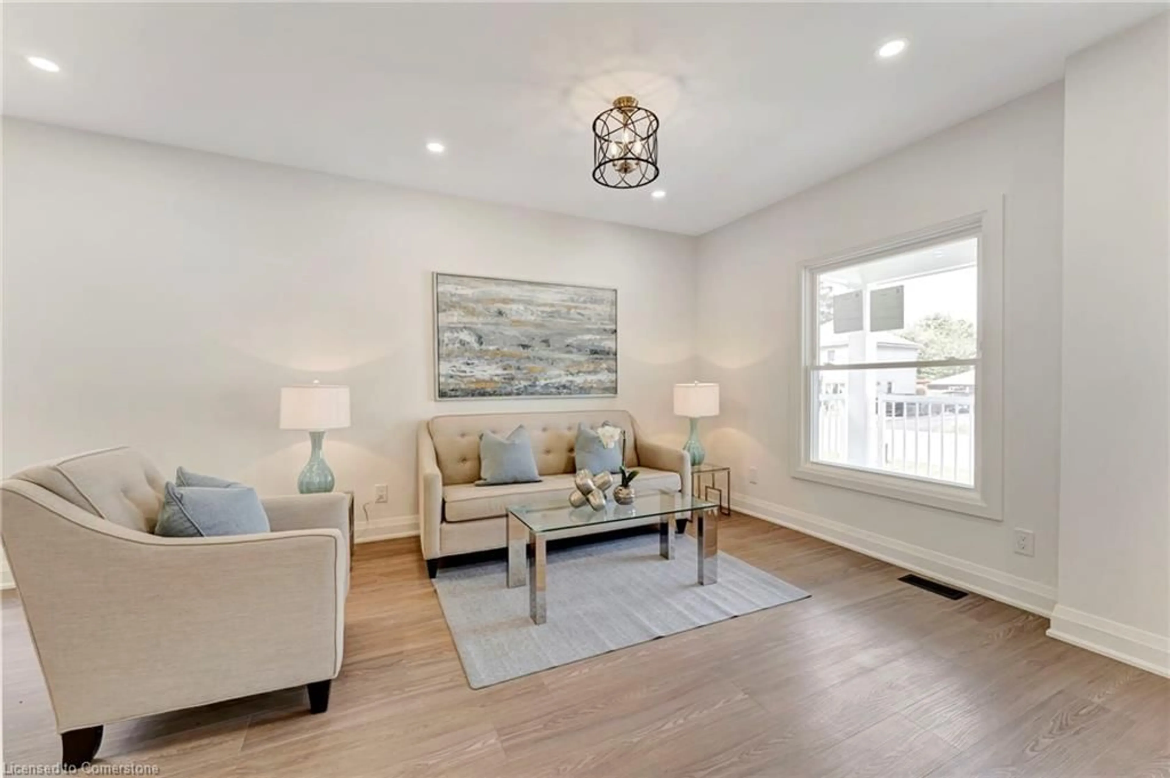 Living room with furniture, wood/laminate floor for 430 Alder St, Dunnville Ontario N1A 1E5