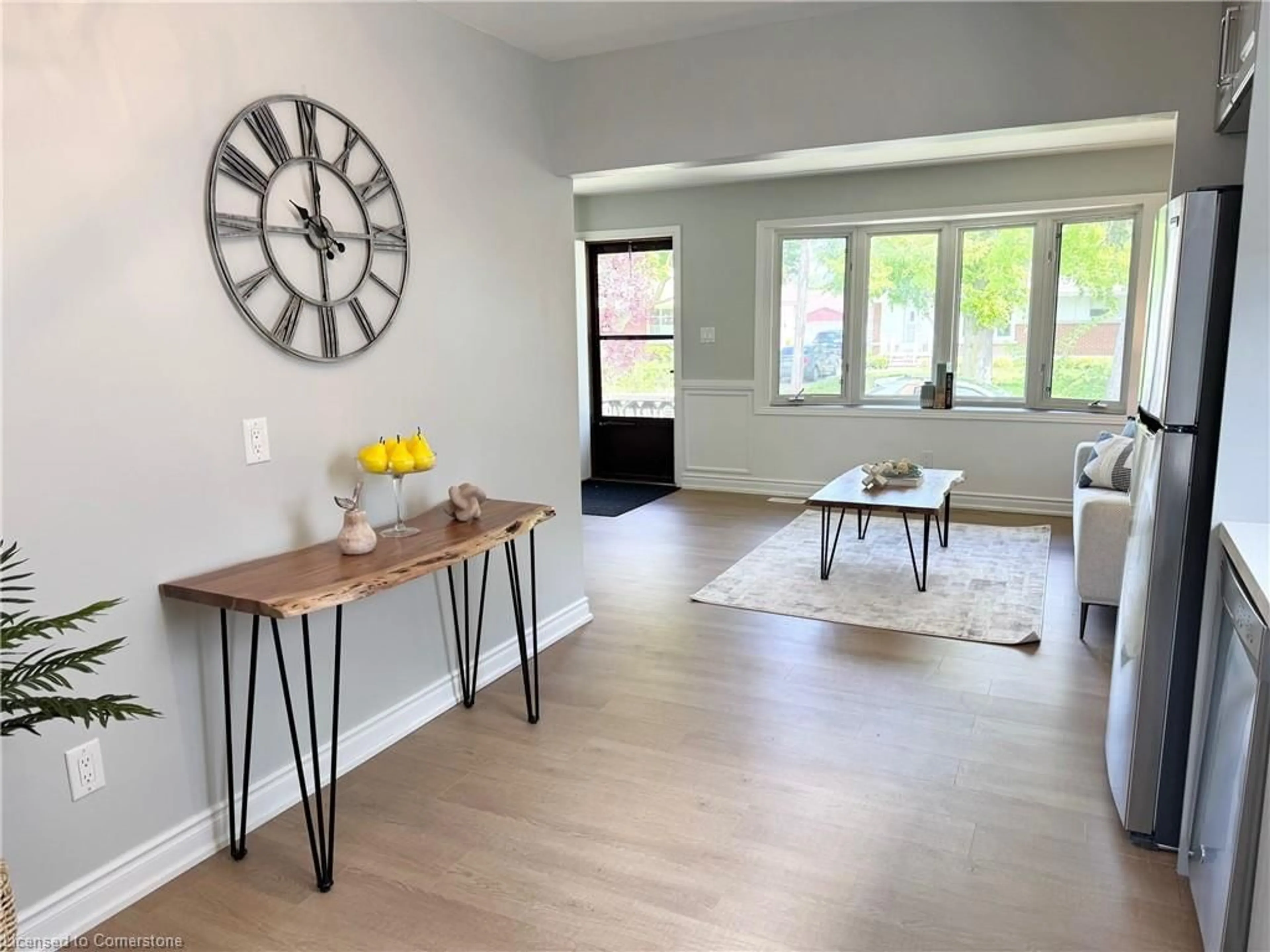 Living room with furniture, wood/laminate floor for 26 Grandfield St, Hamilton Ontario L8T 2H2