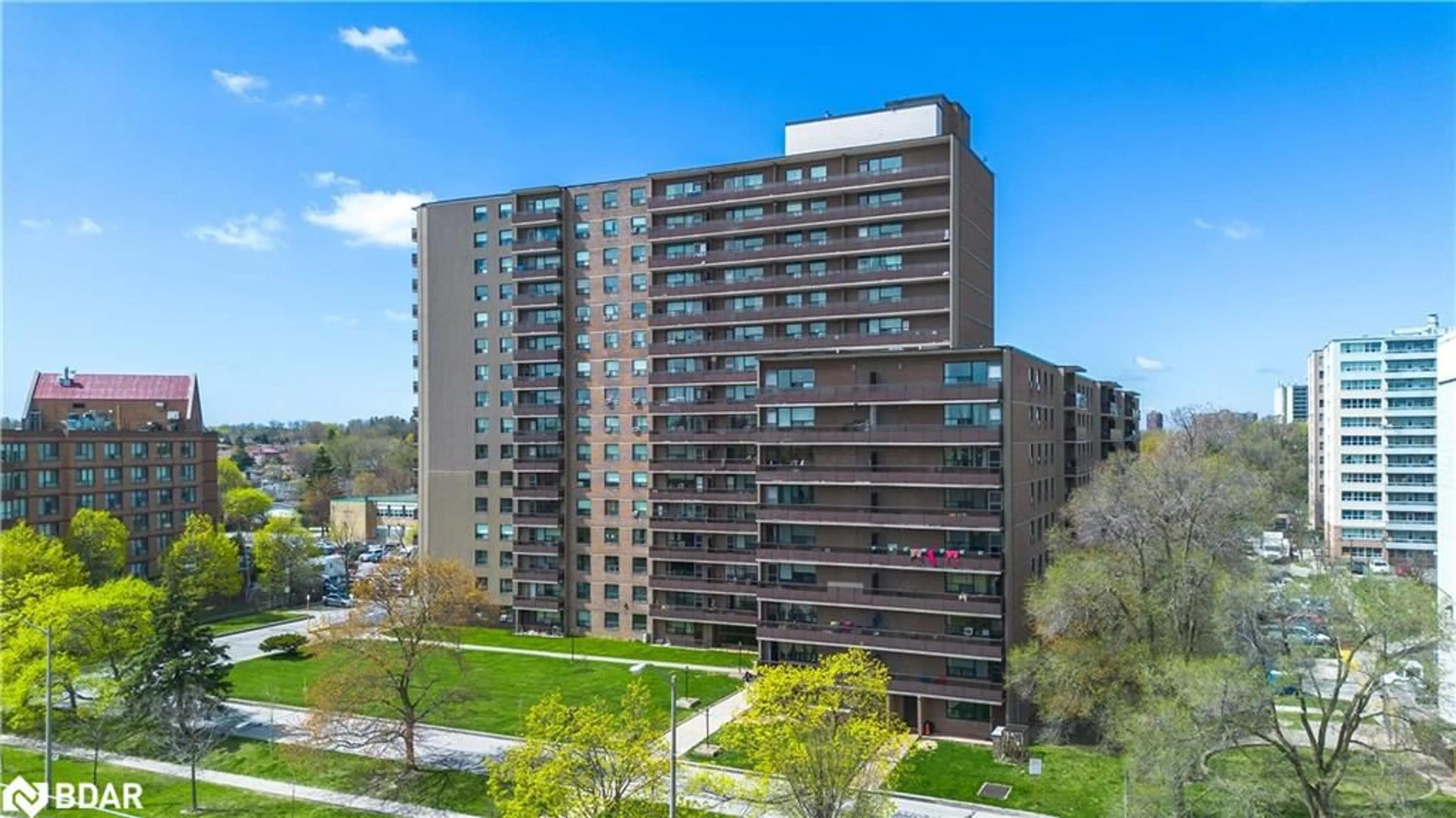A pic from outside/outdoor area/front of a property/back of a property/a pic from drone, city buildings view from balcony for 180 Markham Rd #117, Toronto Ontario M1M 2Z9