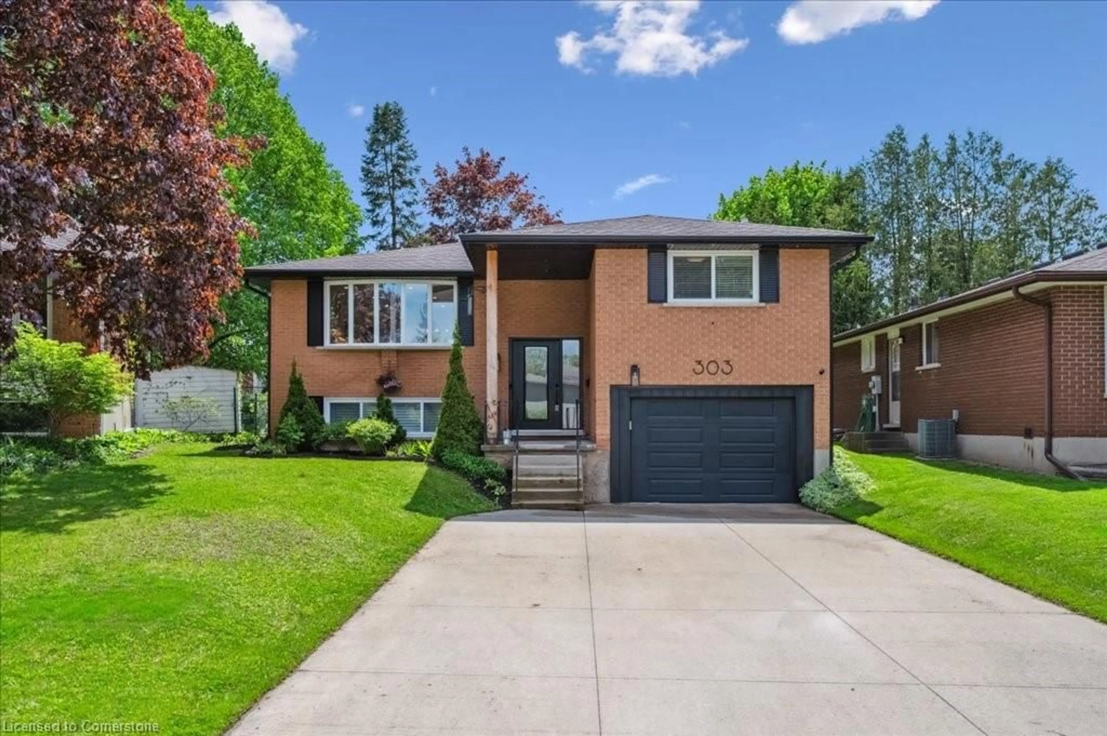 Home with brick exterior material, street for 303 Martindale Cres, Waterloo Ontario N2L 4M8