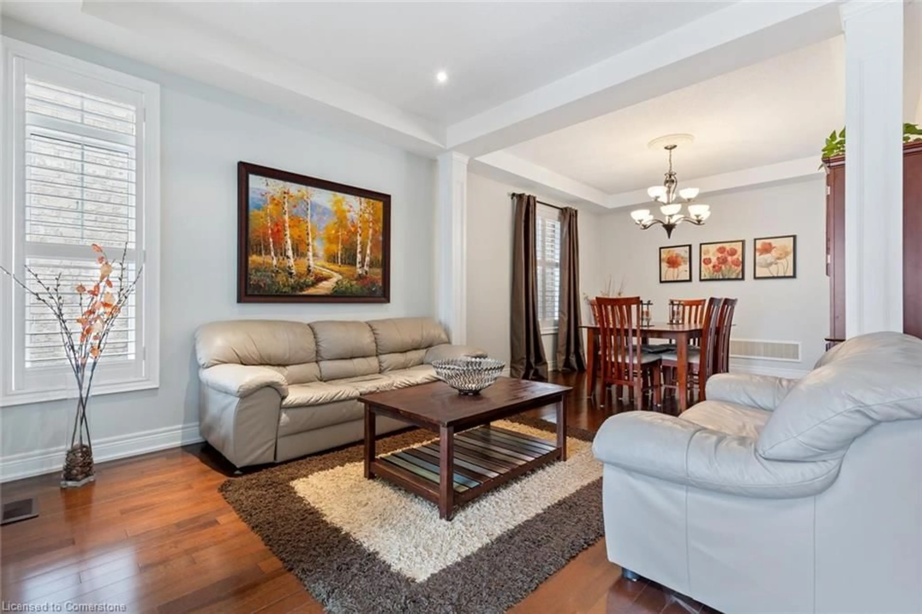 Living room with furniture, wood/laminate floor for 22 Interlacken Drive, Brampton Ontario L6X 0W7