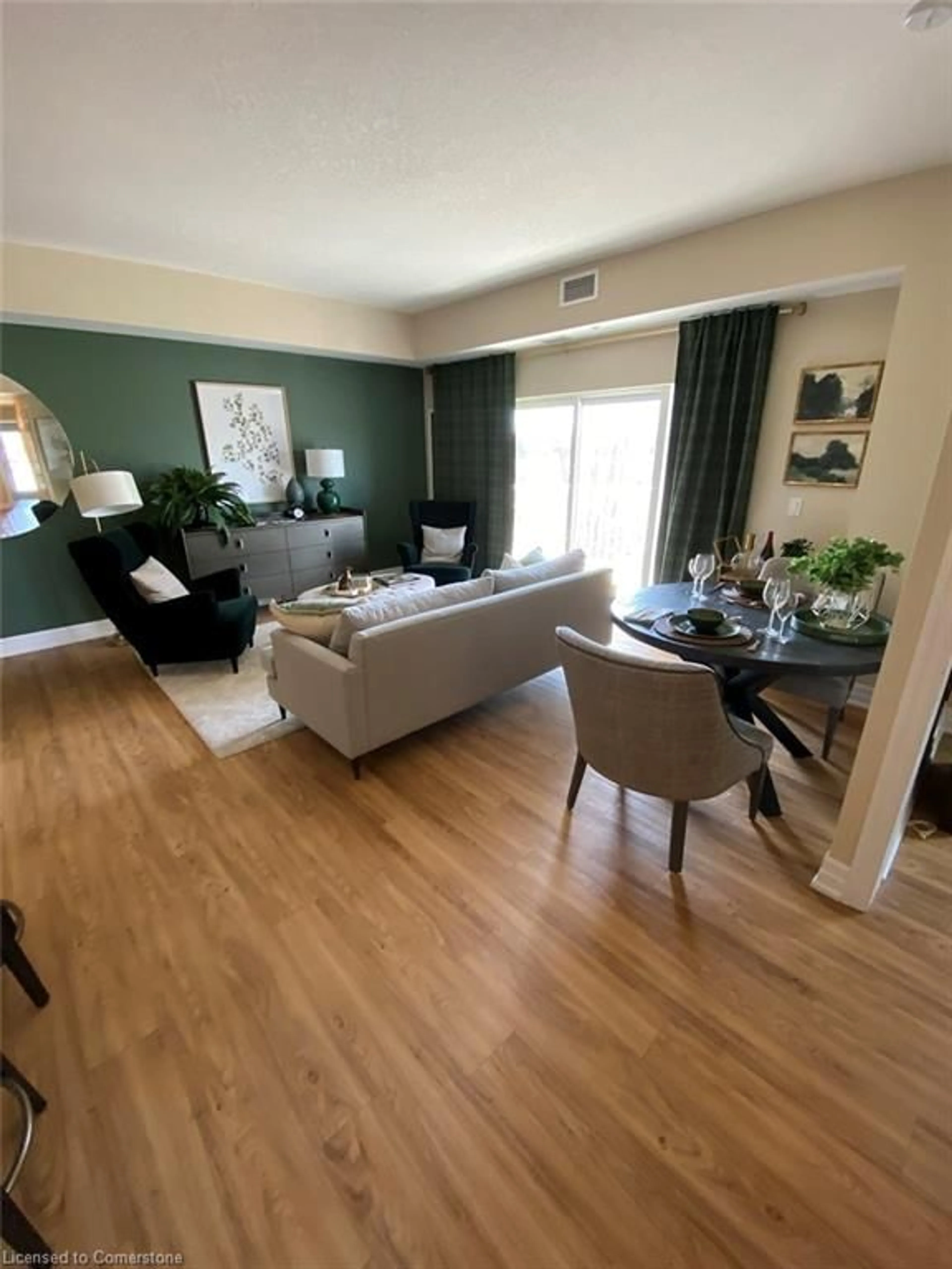 Living room with furniture, wood/laminate floor for 39 Sister Varga Terr #115, Hamilton Ontario L9B 0J7