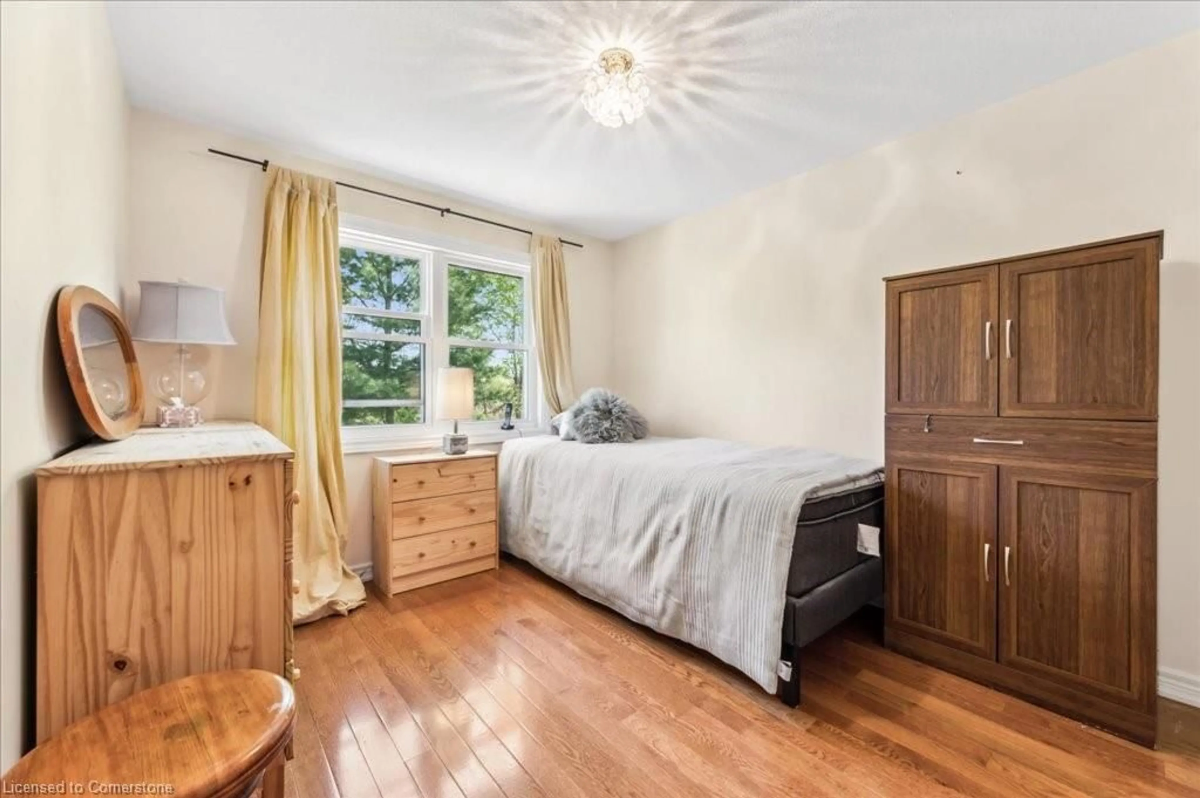 Bedroom with bed, wood/laminate floor for 19 Housler Lane, Cambridge Ontario N3C 4H7