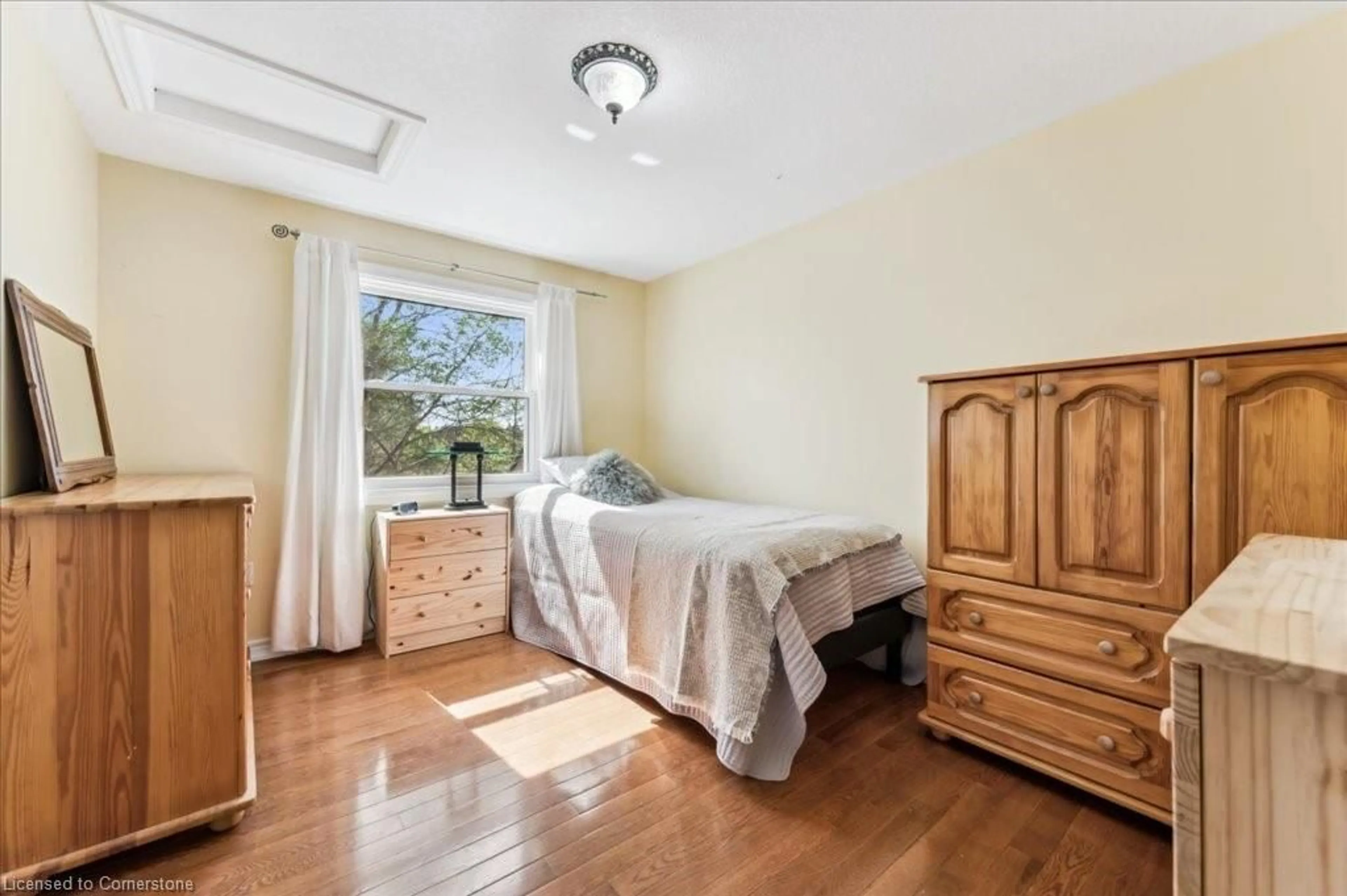 Bedroom with bed, wood/laminate floor for 19 Housler Lane, Cambridge Ontario N3C 4H7