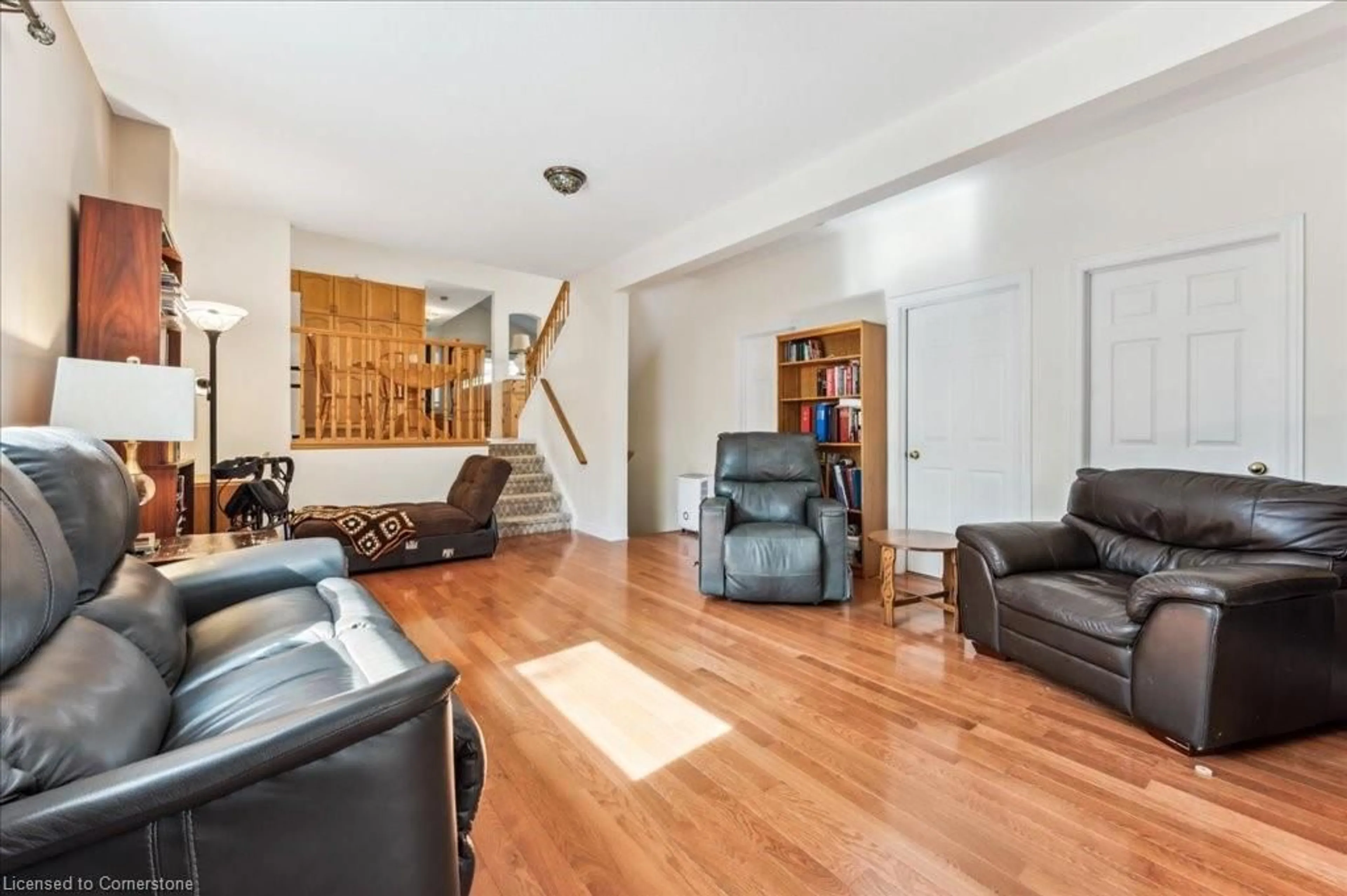 Living room with furniture, wood/laminate floor for 19 Housler Lane, Cambridge Ontario N3C 4H7