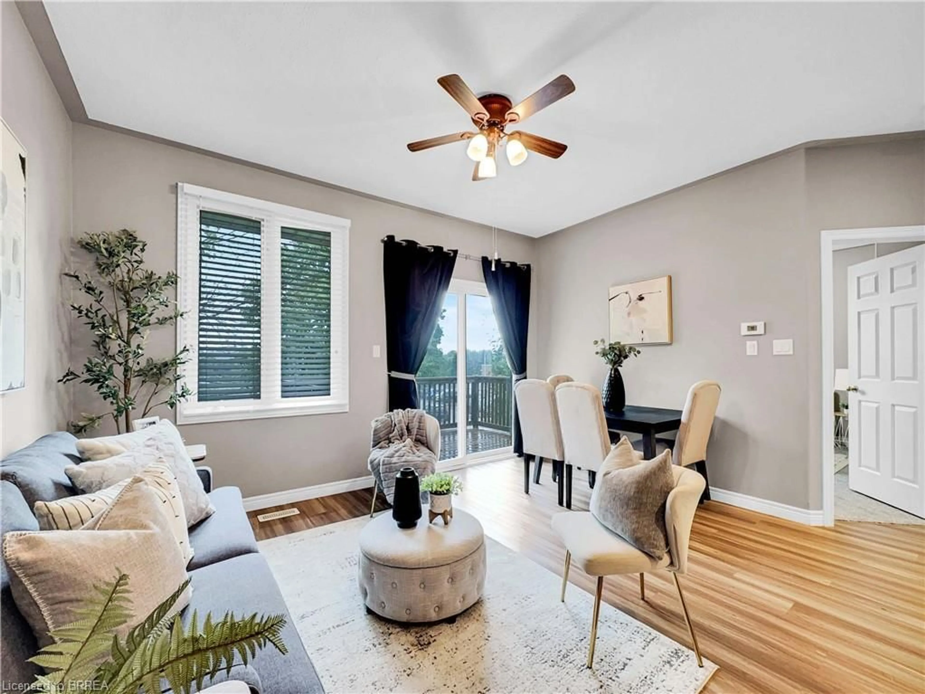 Living room with furniture, wood/laminate floor for 219 Shellard Lane #14, Brantford Ontario N3T 5L5