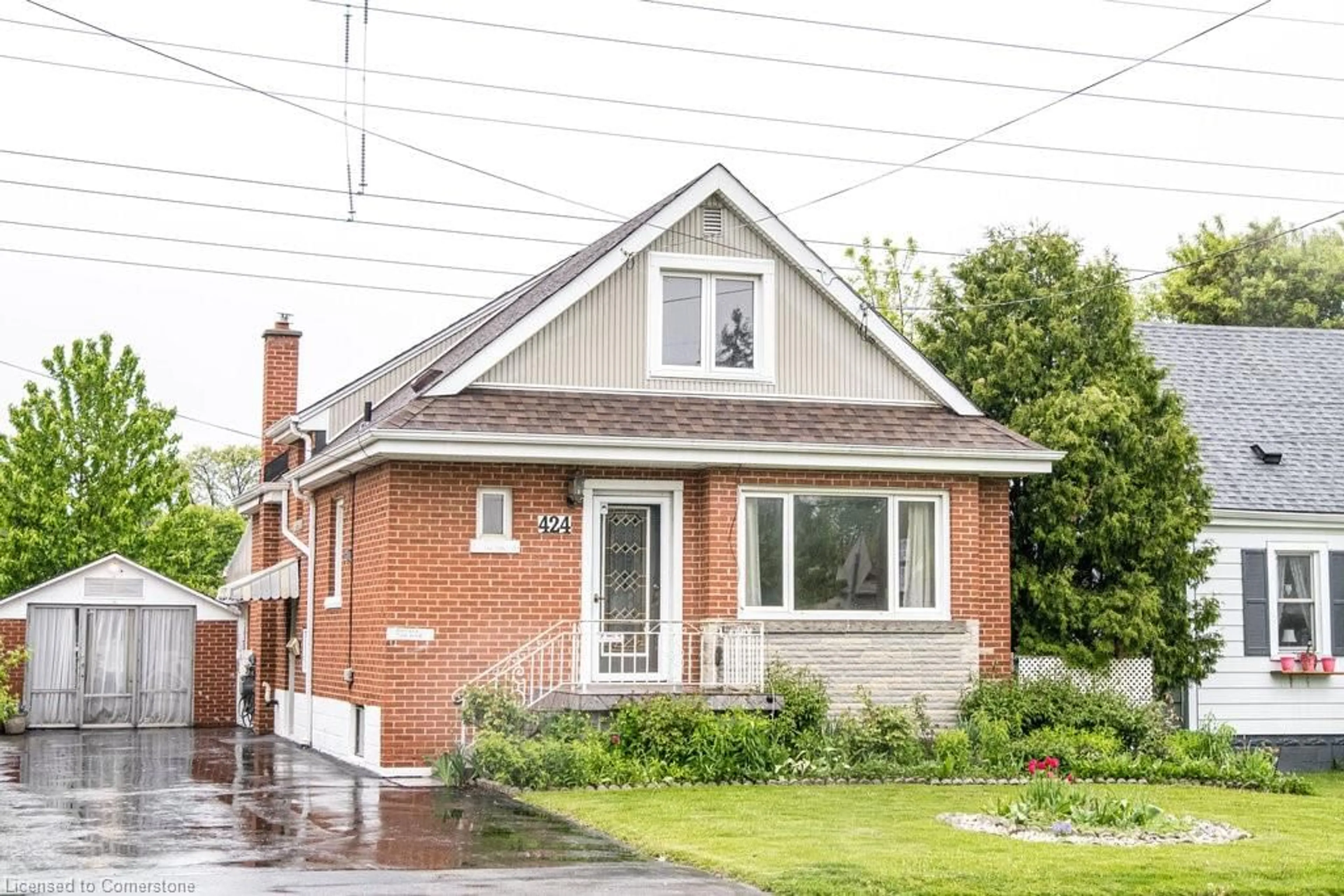 Home with brick exterior material, street for 424 Cochrane Rd, Hamilton Ontario L8K 3G9