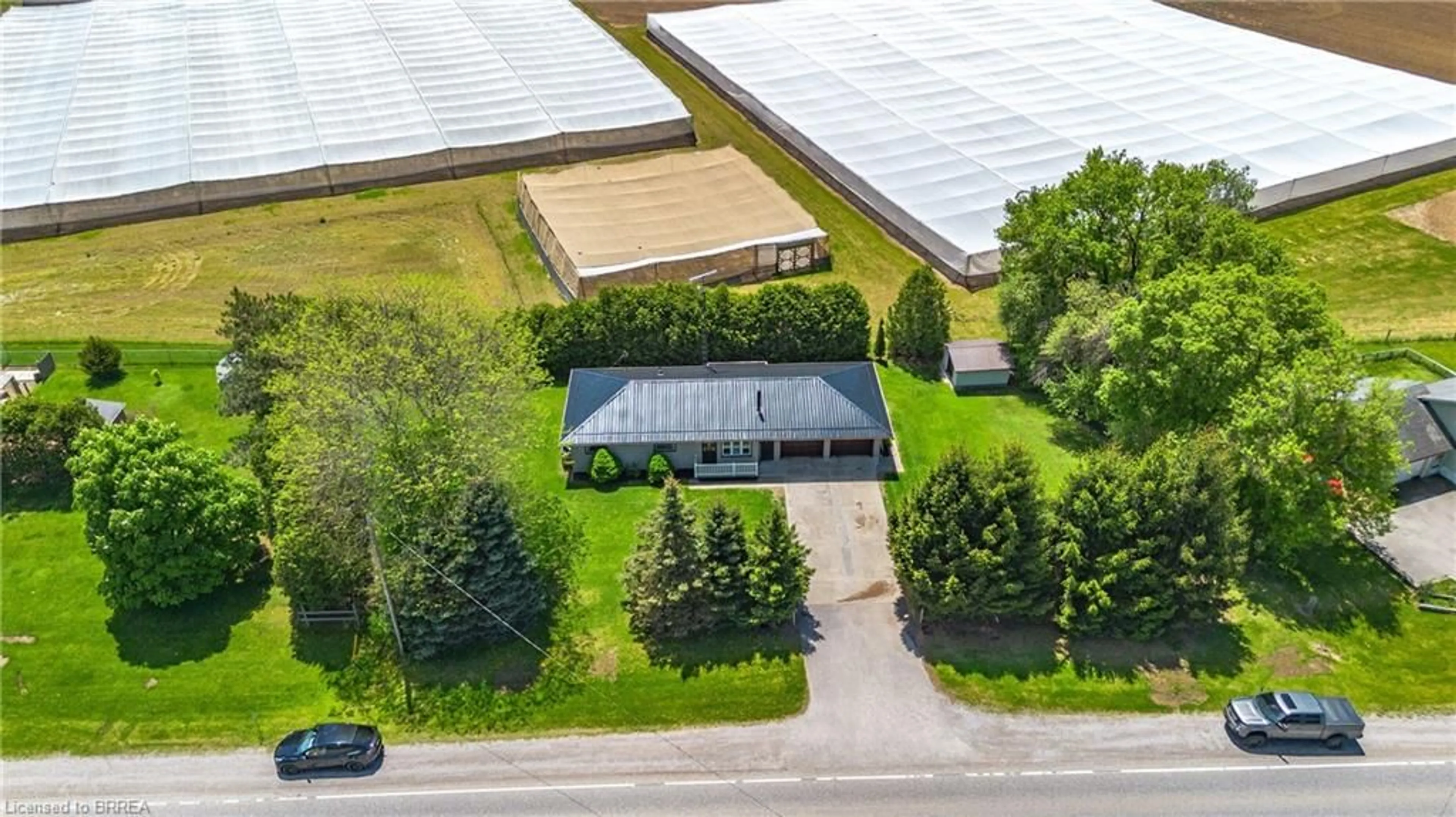 A pic from outside/outdoor area/front of a property/back of a property/a pic from drone, building for 2066 #3 Hwy, Delhi Ontario N4B 2W4