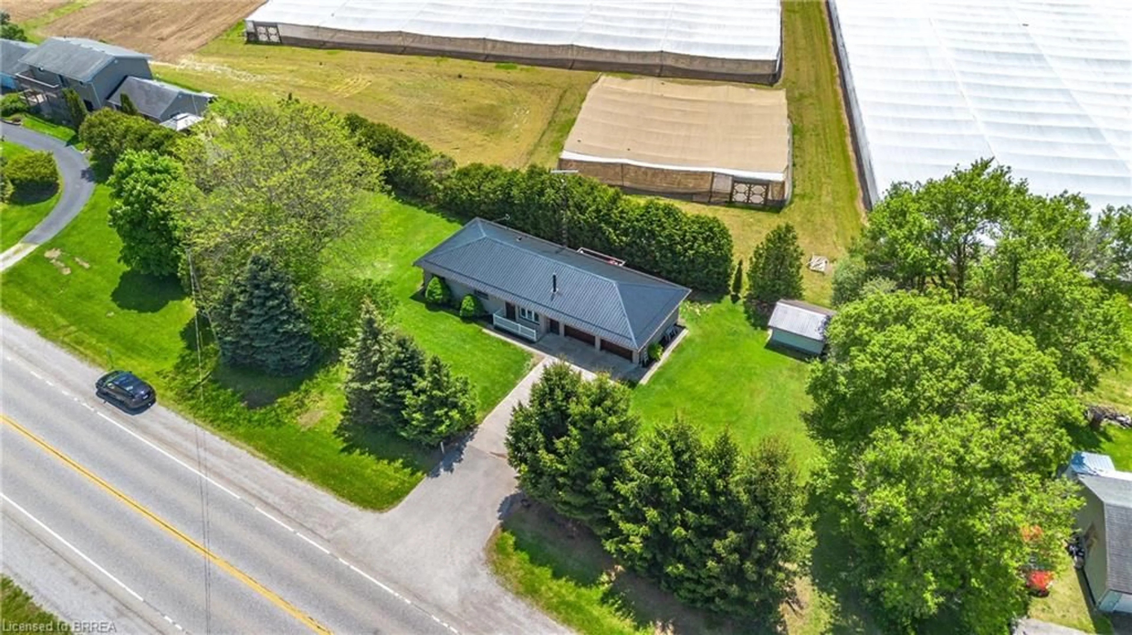 A pic from outside/outdoor area/front of a property/back of a property/a pic from drone, building for 2066 #3 Hwy, Delhi Ontario N4B 2W4