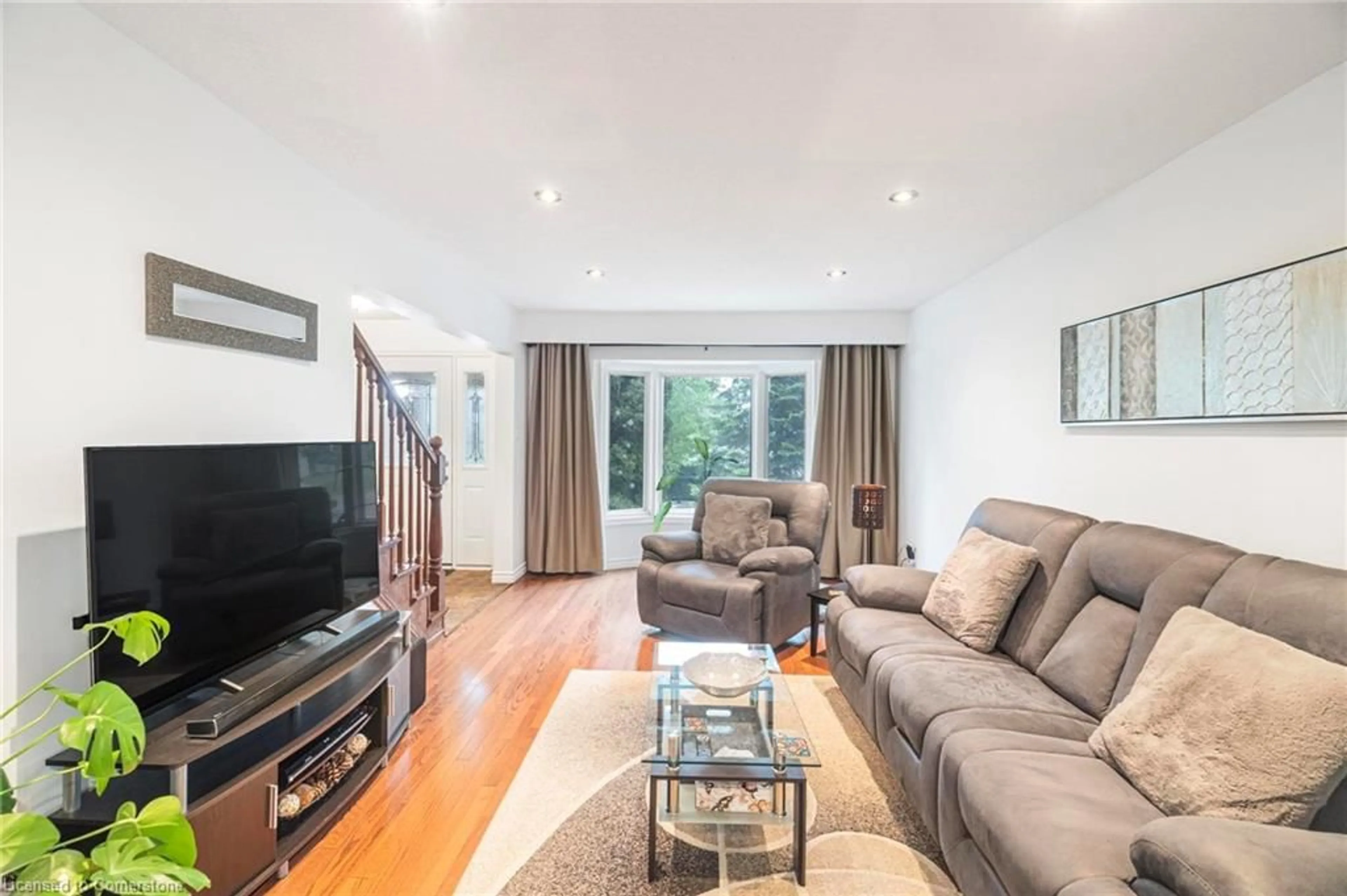 Living room with furniture, wood/laminate floor for 247 Westheights Dr, Kitchener Ontario N2N 1K3