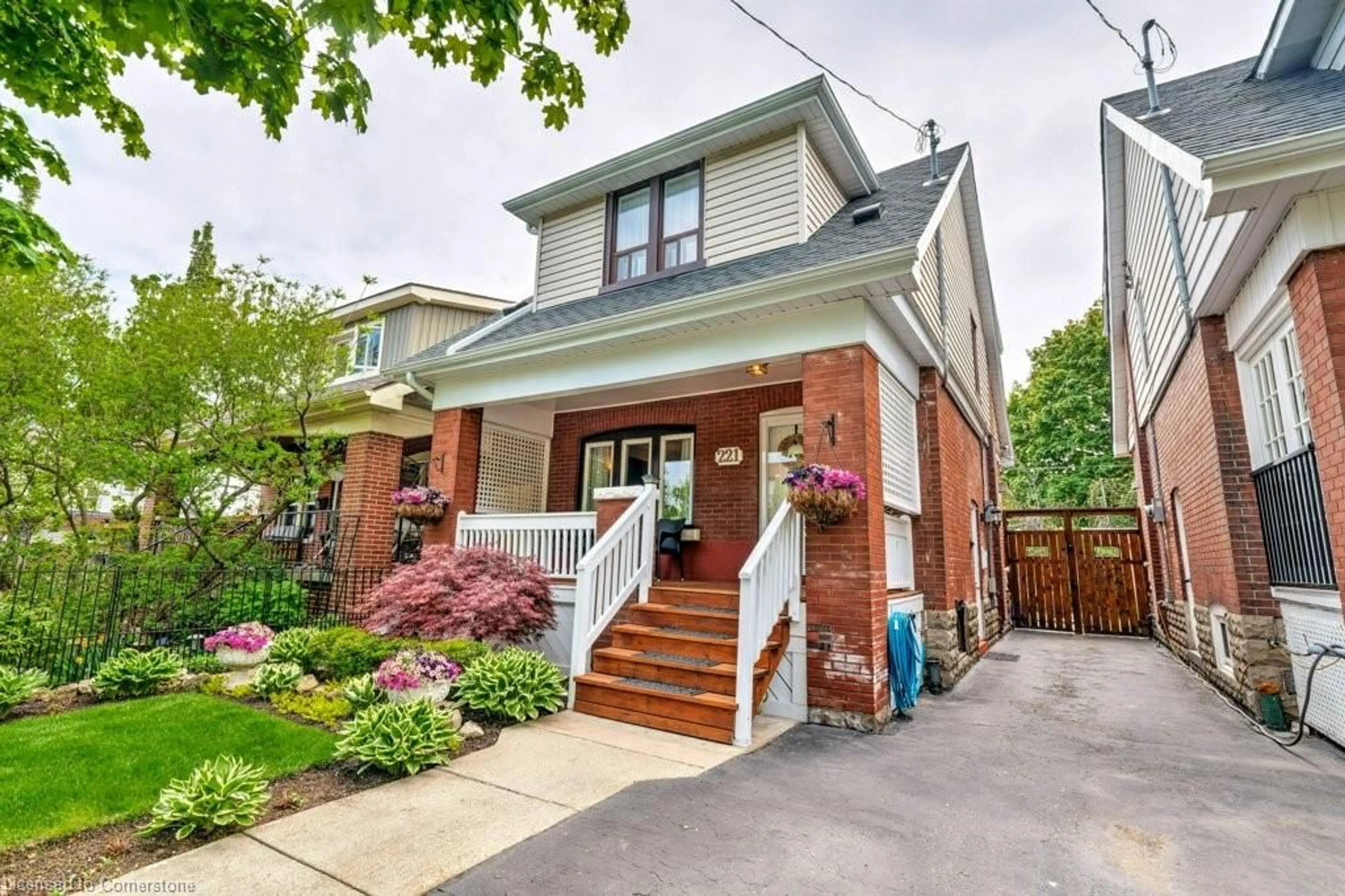 Home with brick exterior material, street for 221 Park Row, Hamilton Ontario L8K 2K4