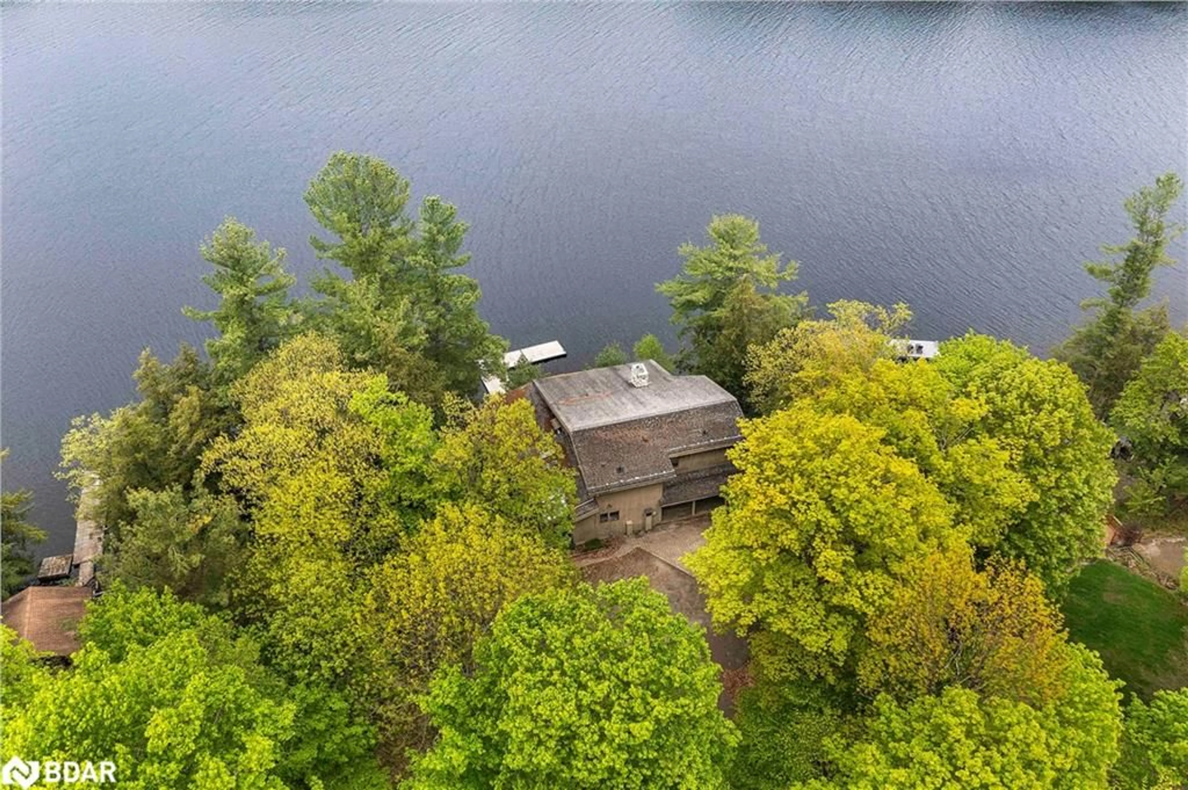A pic from outside/outdoor area/front of a property/back of a property/a pic from drone, water/lake/river/ocean view for 4 Limbert Lane, Parry Sound Ontario P2A 2W9