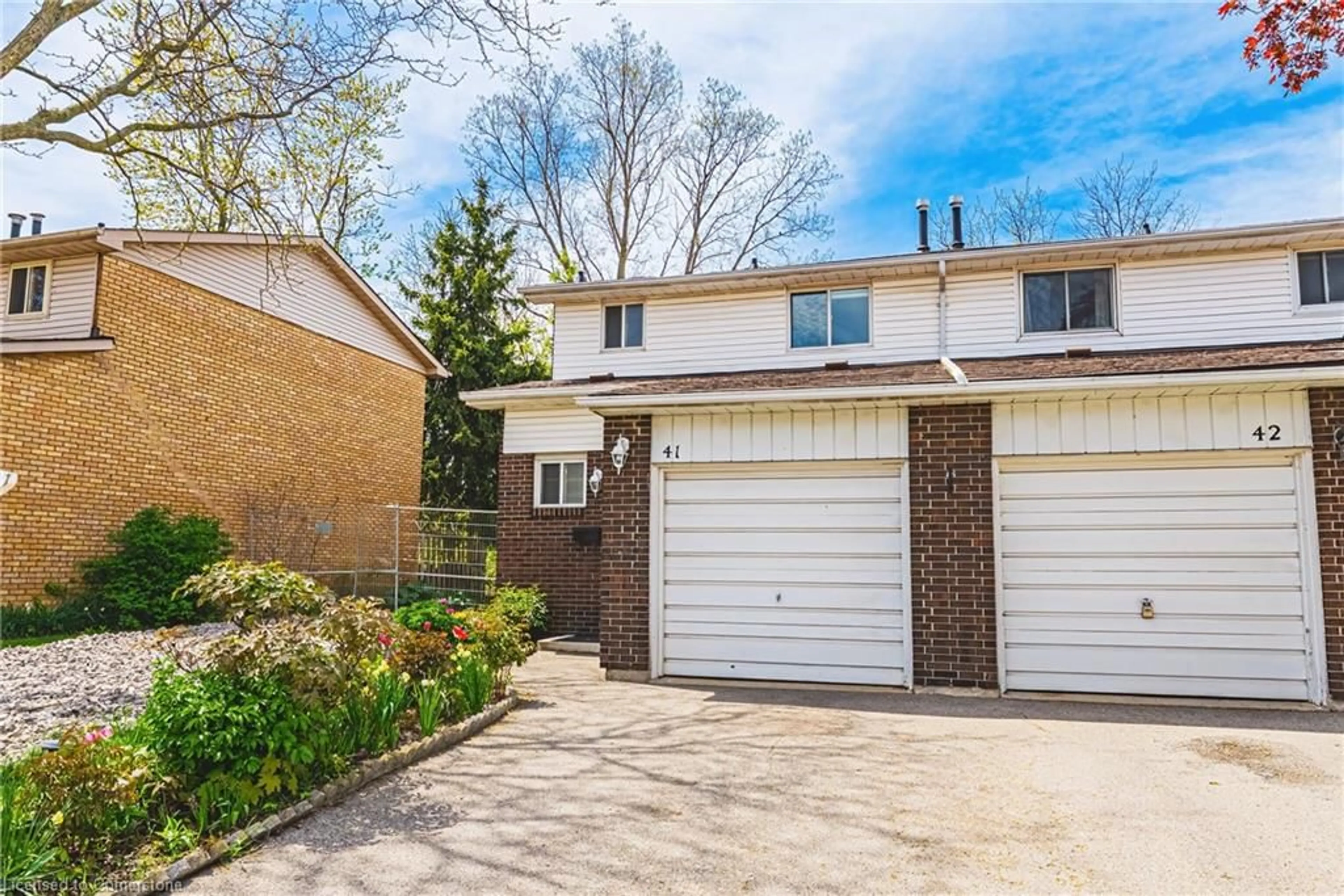 Home with brick exterior material, street for 100 Quigley Rd #41, Hamilton Ontario L8K 6J1