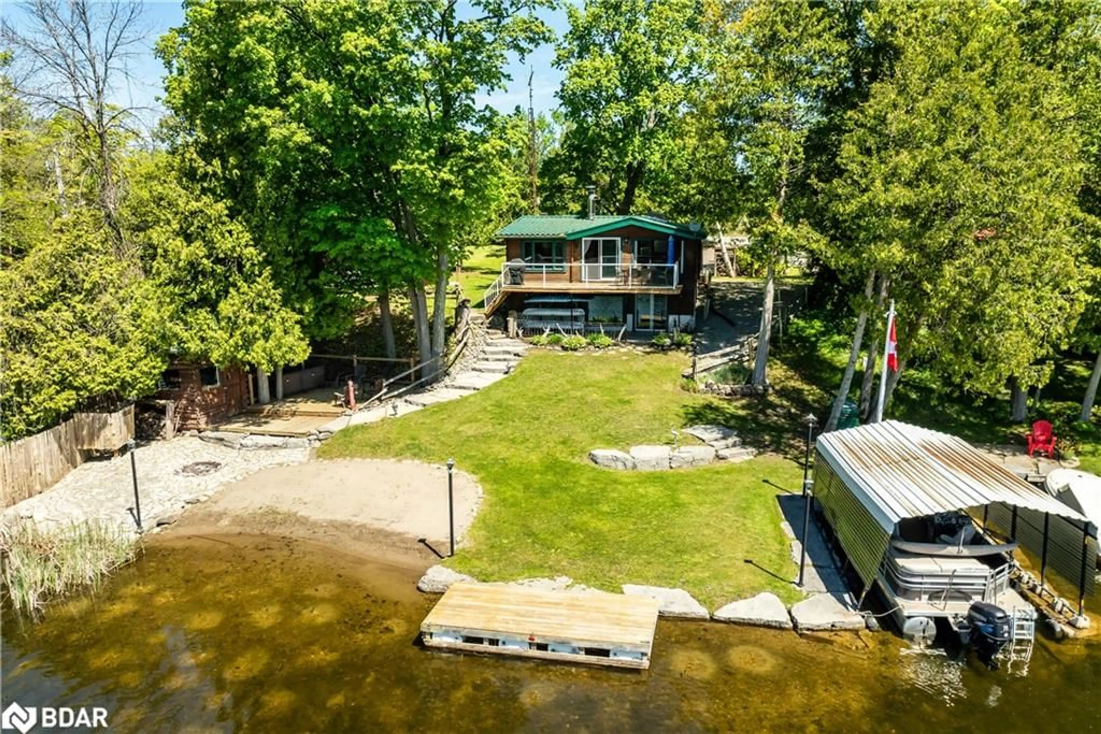 A pic from outside/outdoor area/front of a property/back of a property/a pic from drone, water/lake/river/ocean view for 4 Fr 61 Rte, Buckhorn Ontario K0L 1J0