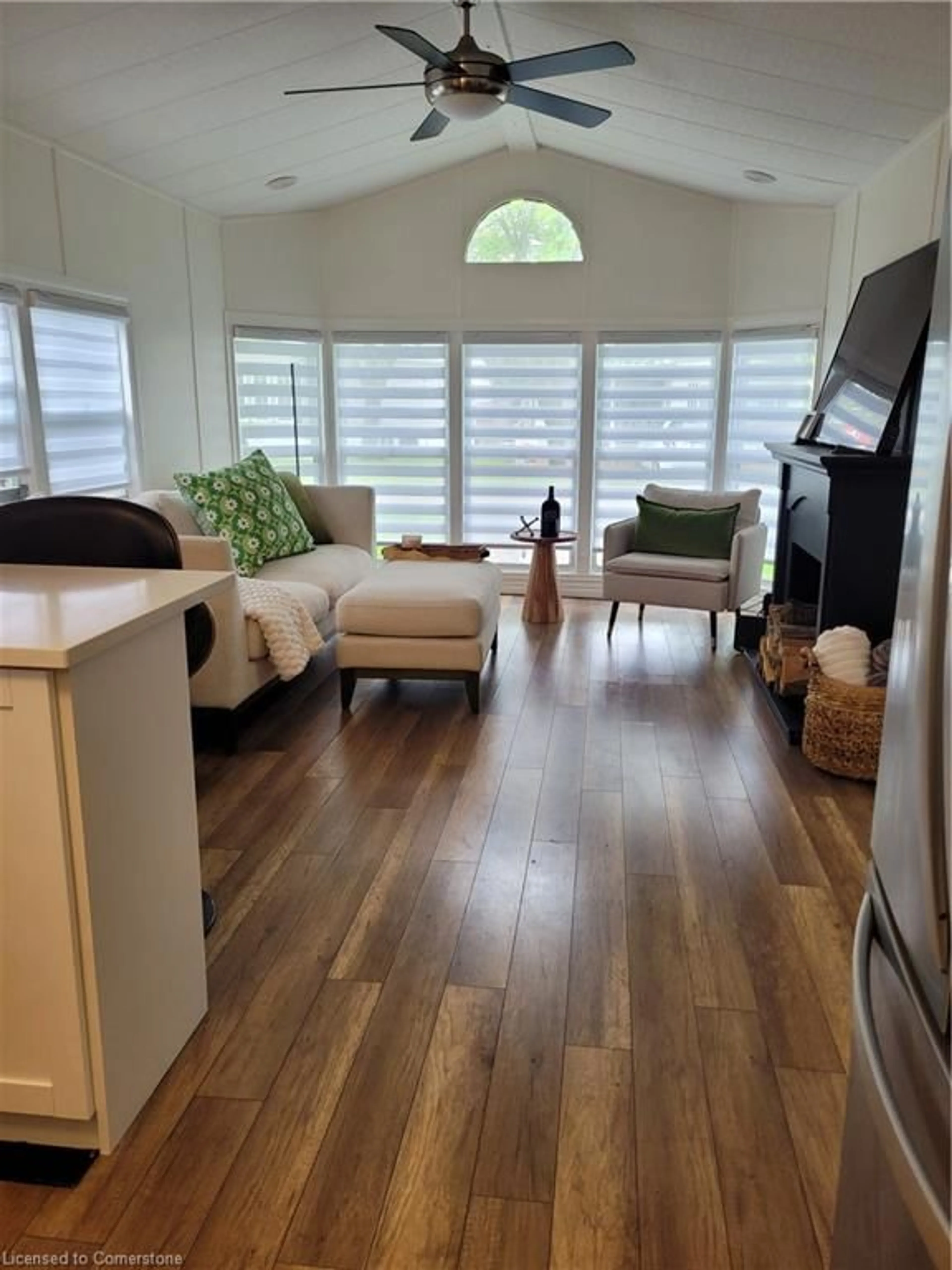 Living room with furniture, wood/laminate floor for 580 Beaver Creek Rd #356, Waterloo Ontario N2J 3Z4