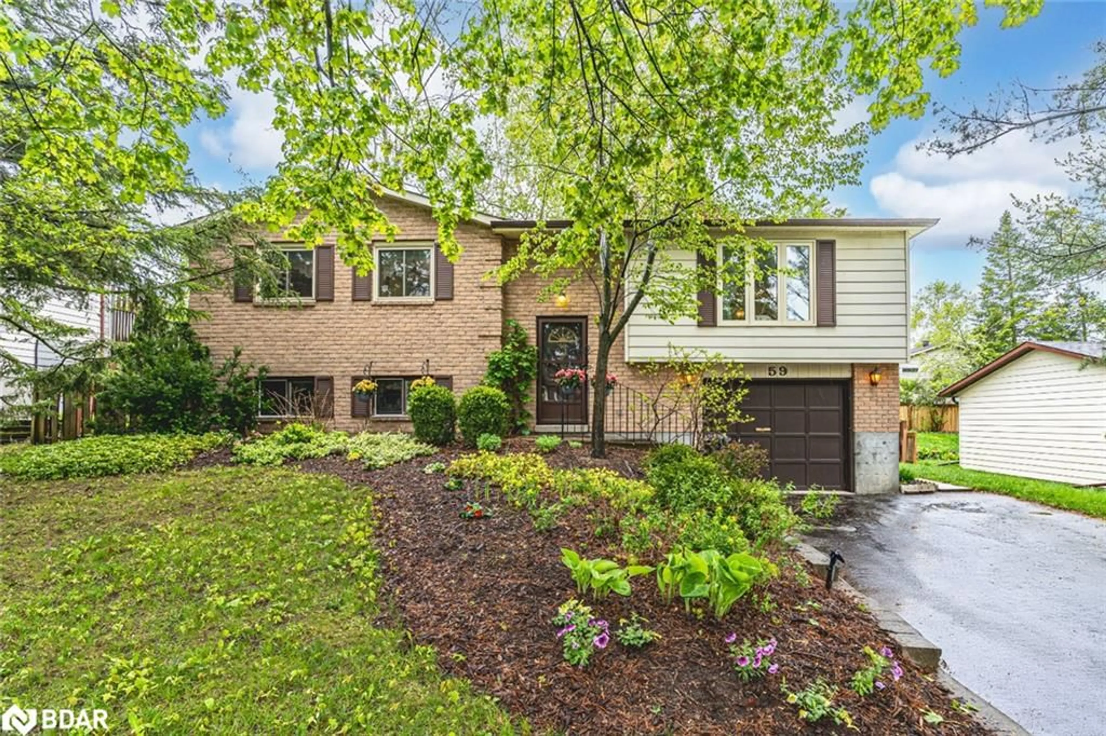 Home with brick exterior material, street for 59 Indian Arrow Rd, Barrie Ontario L4M 5P1