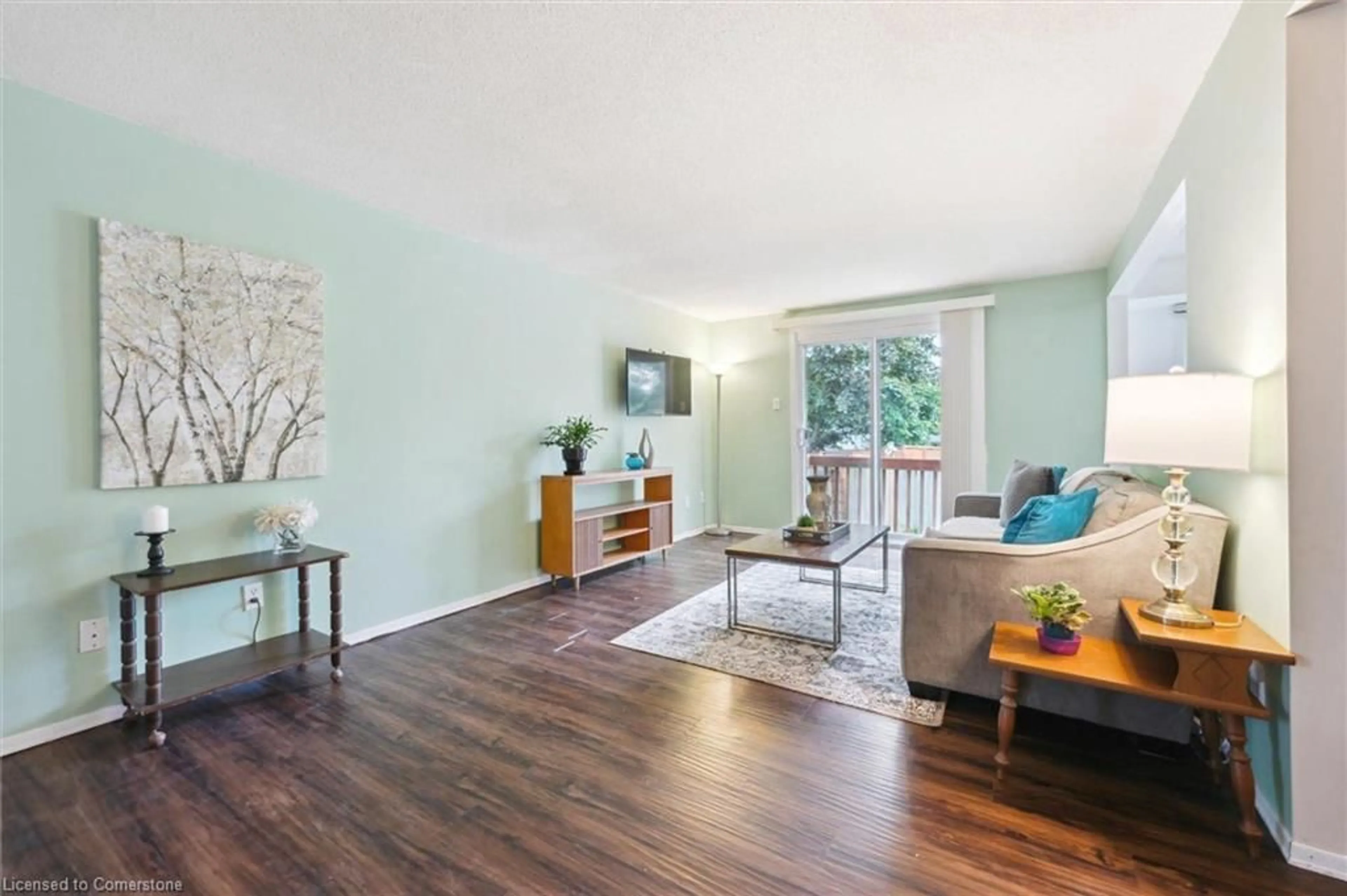 Living room with furniture, wood/laminate floor for 61 Leacock Ave, Guelph Ontario N1E 6P9