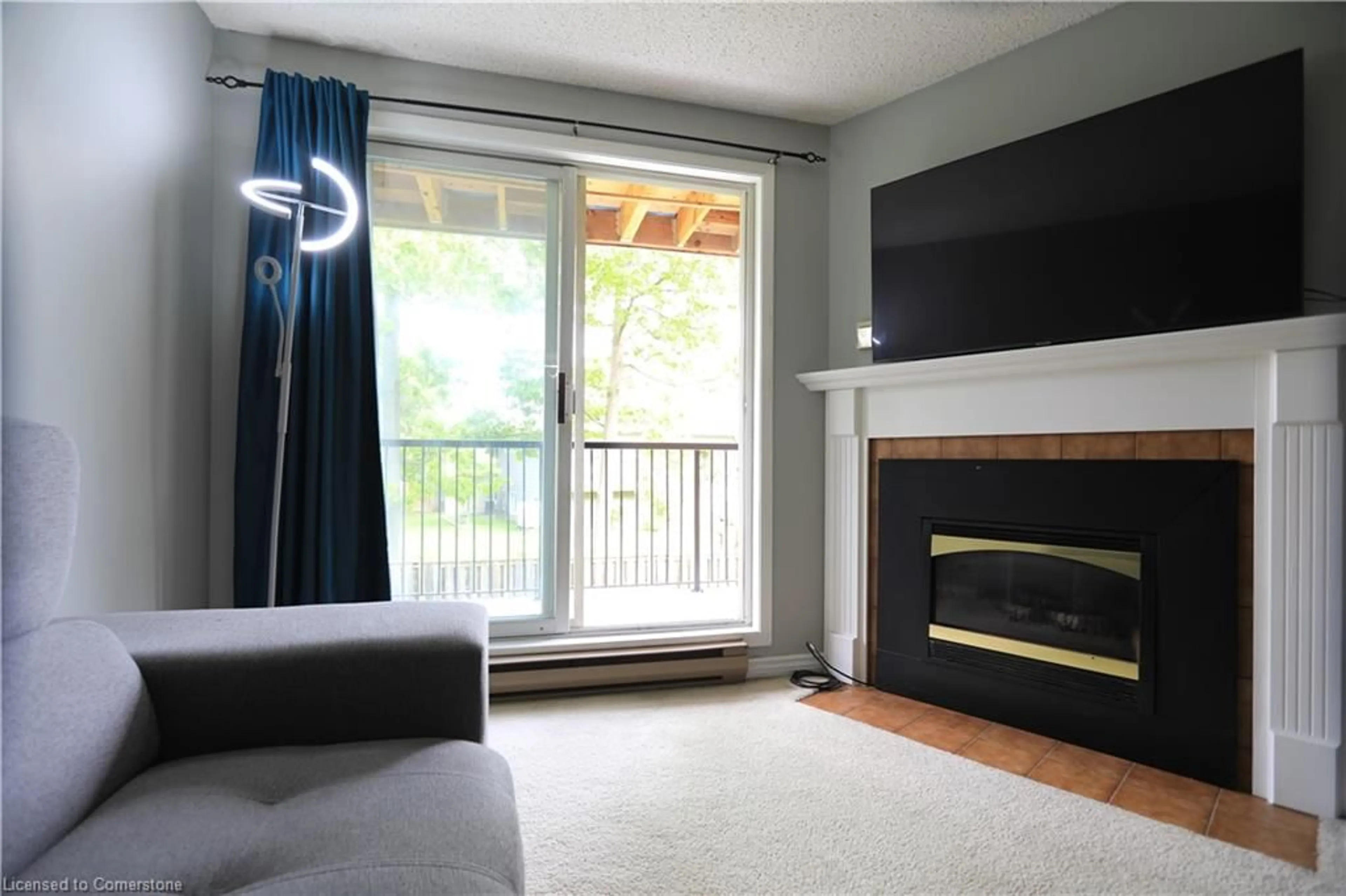 Living room with furniture, wood/laminate floor for 1096 Jalna Blvd #64, London Ontario N6E 3B8