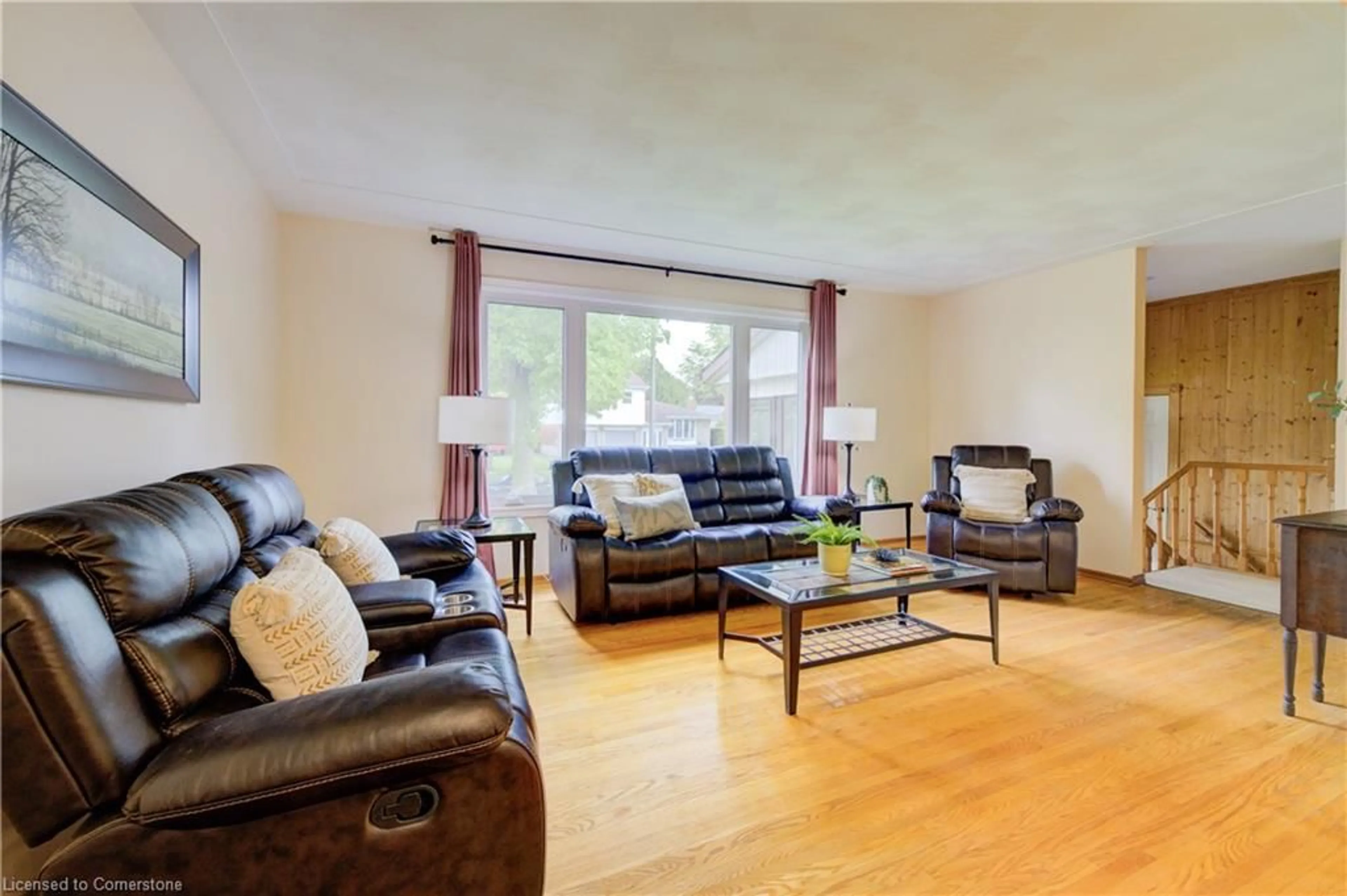 Living room with furniture, wood/laminate floor for 90 Indian Rd, Kitchener Ontario N2B 2S5