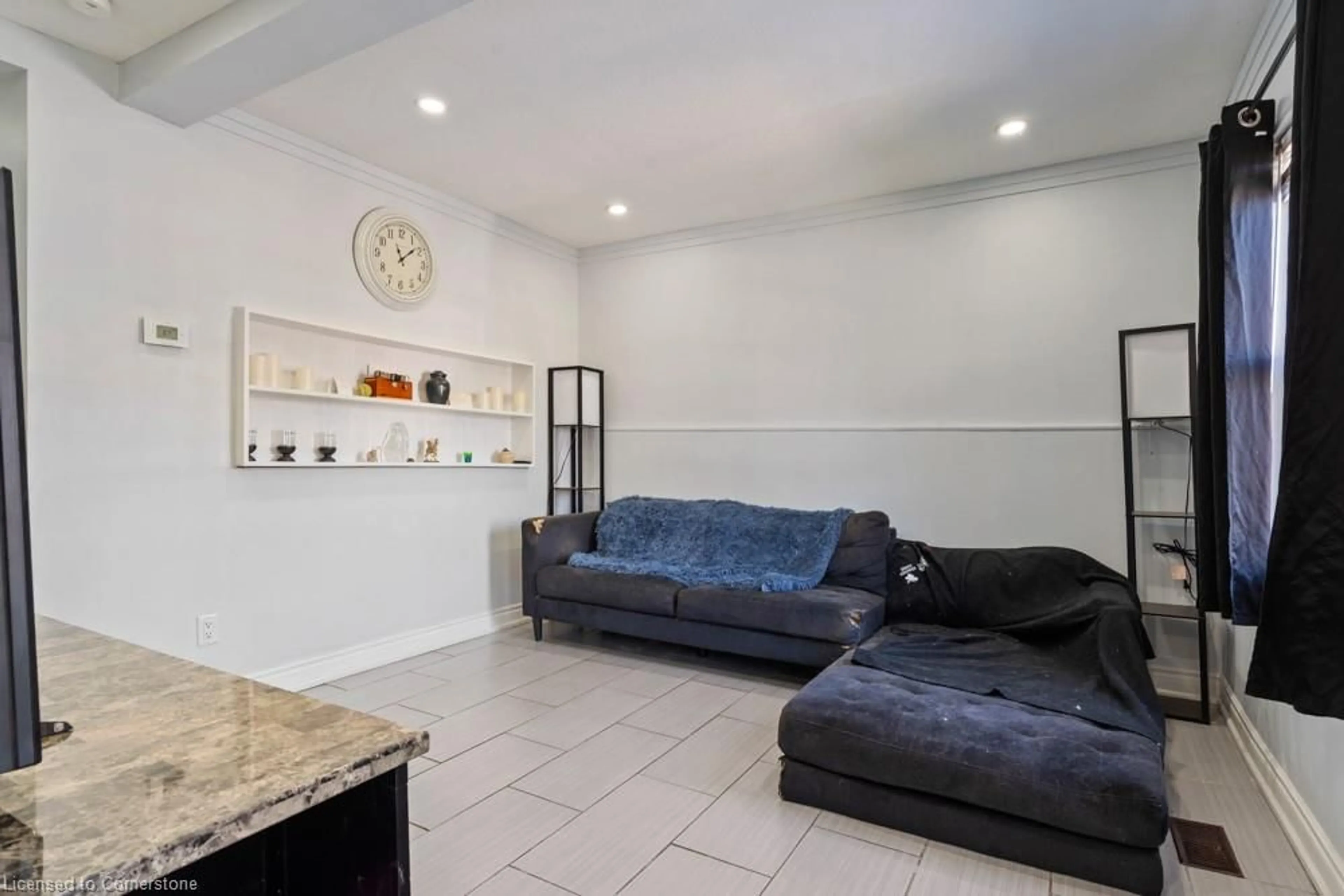 Living room with furniture, ceramic/tile floor for 30 Robins Ave, Hamilton Ontario L8H 4M9
